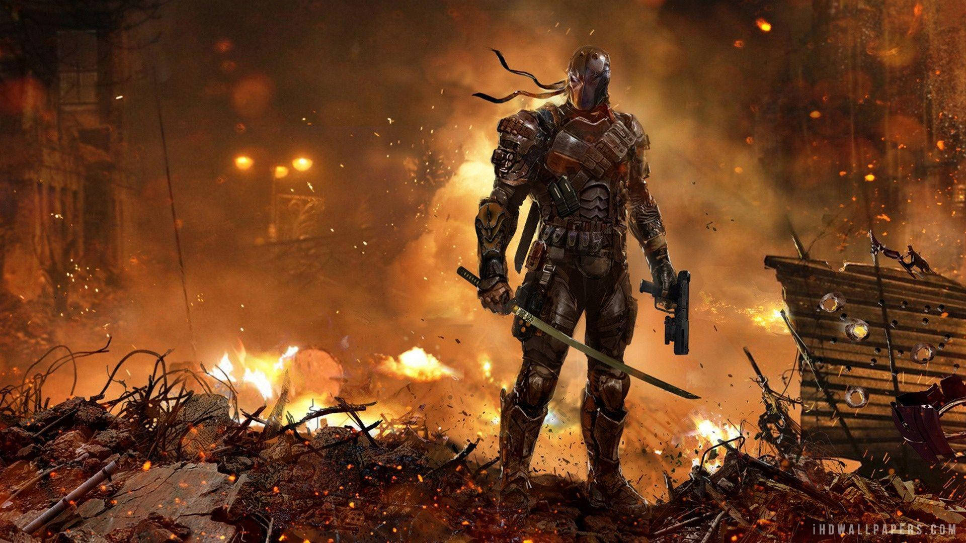 A Man In Armor Standing In A City With Fire Background