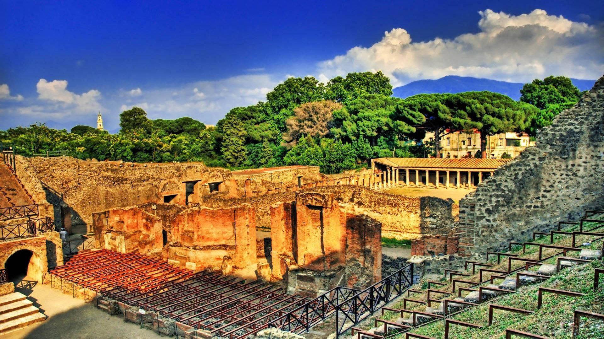 A View Of The Ancient Roman Theater In Pompeii Background