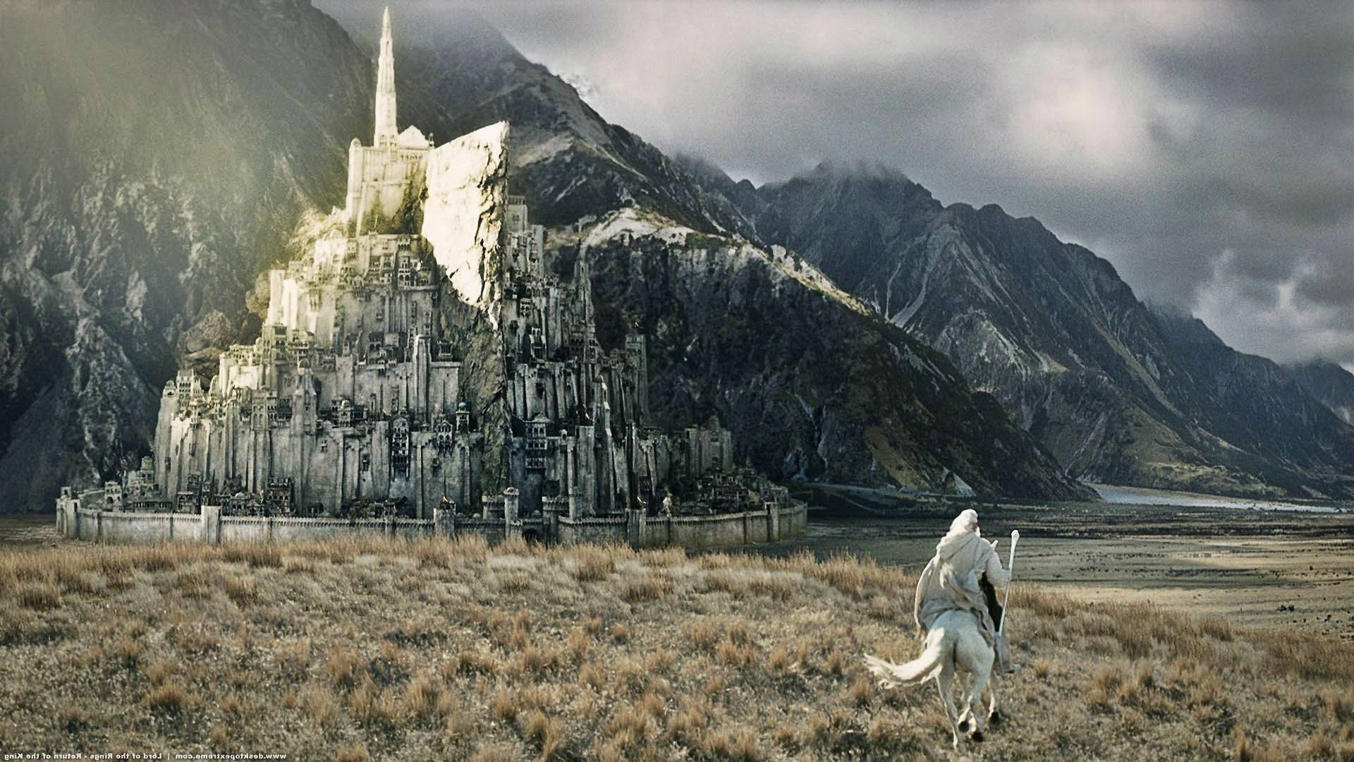 A White Horse Is Walking Through A Field With A Castle In The Background Background