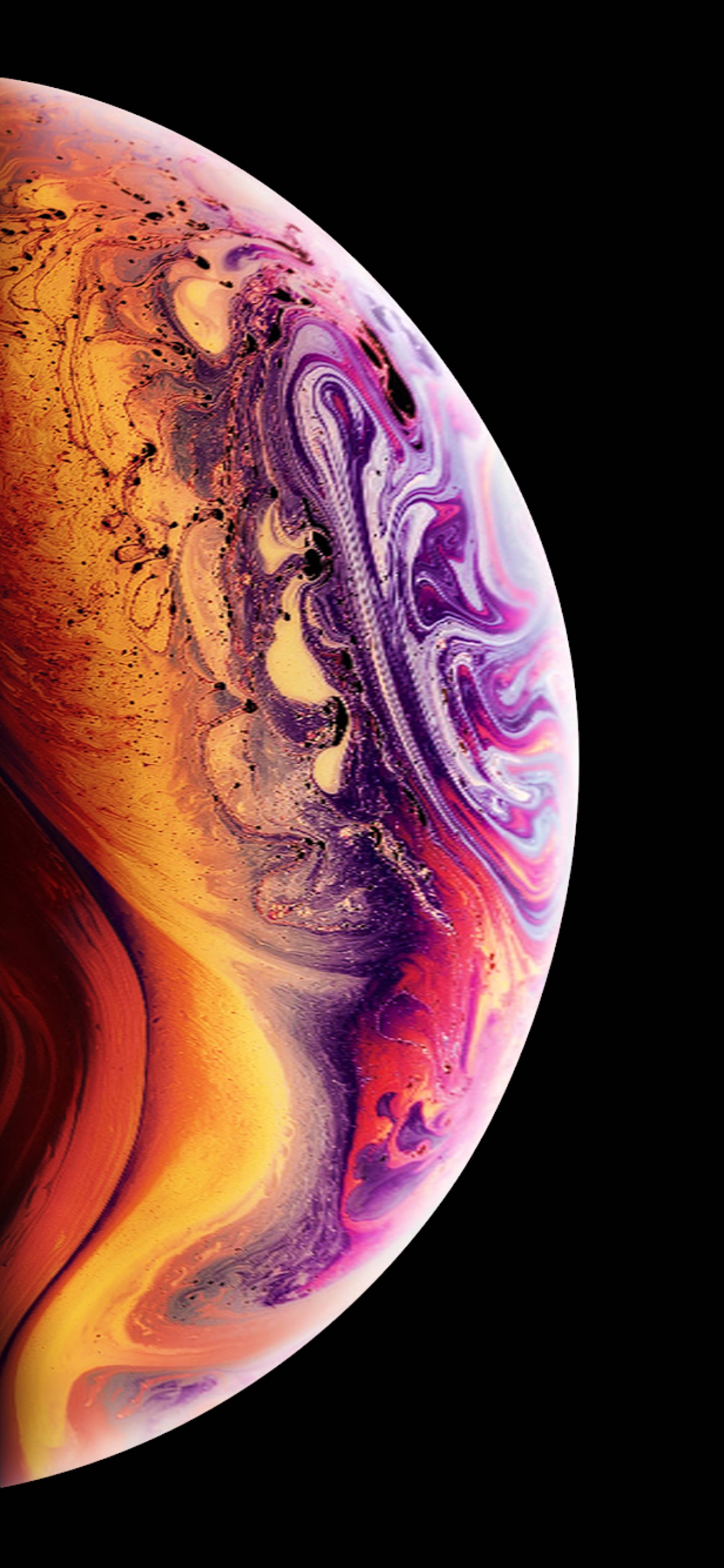 An Image Of An Apple Iphone Xs With A Colorful Swirl Background