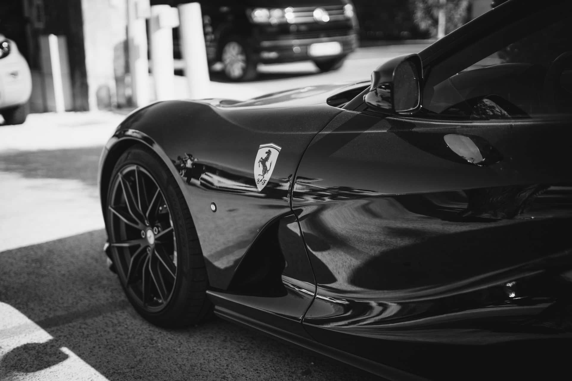 Download Caption: Sleek Black and White Car Wallpaper | Wallpapers.com