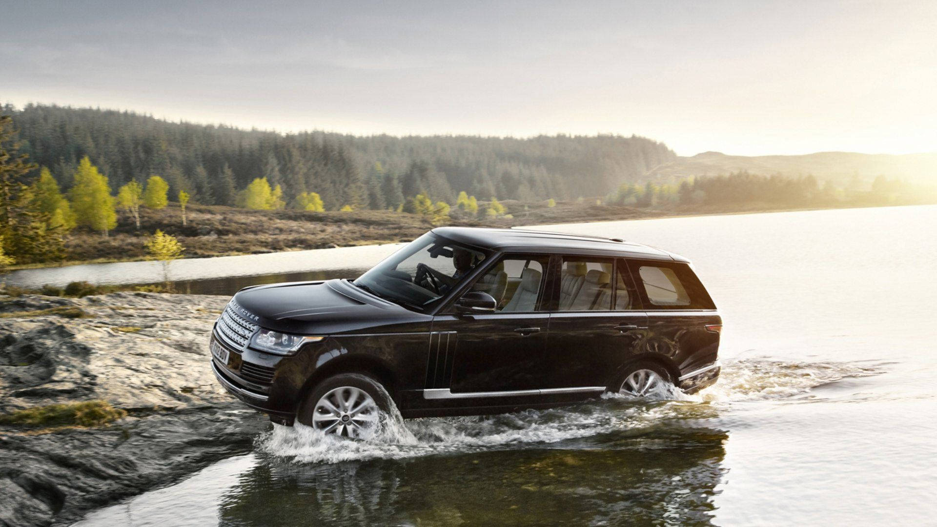 Black Land Rover In Water Background