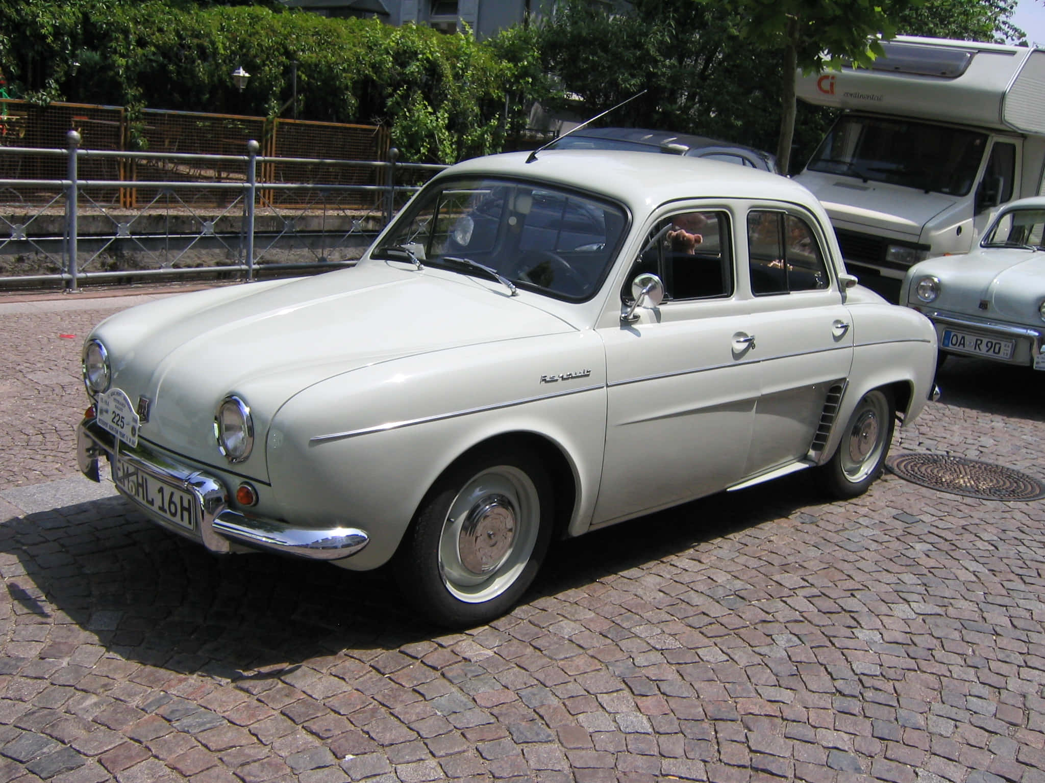 Download Caption: Iconic Renault Dauphine Riding In An Urban Landscape ...