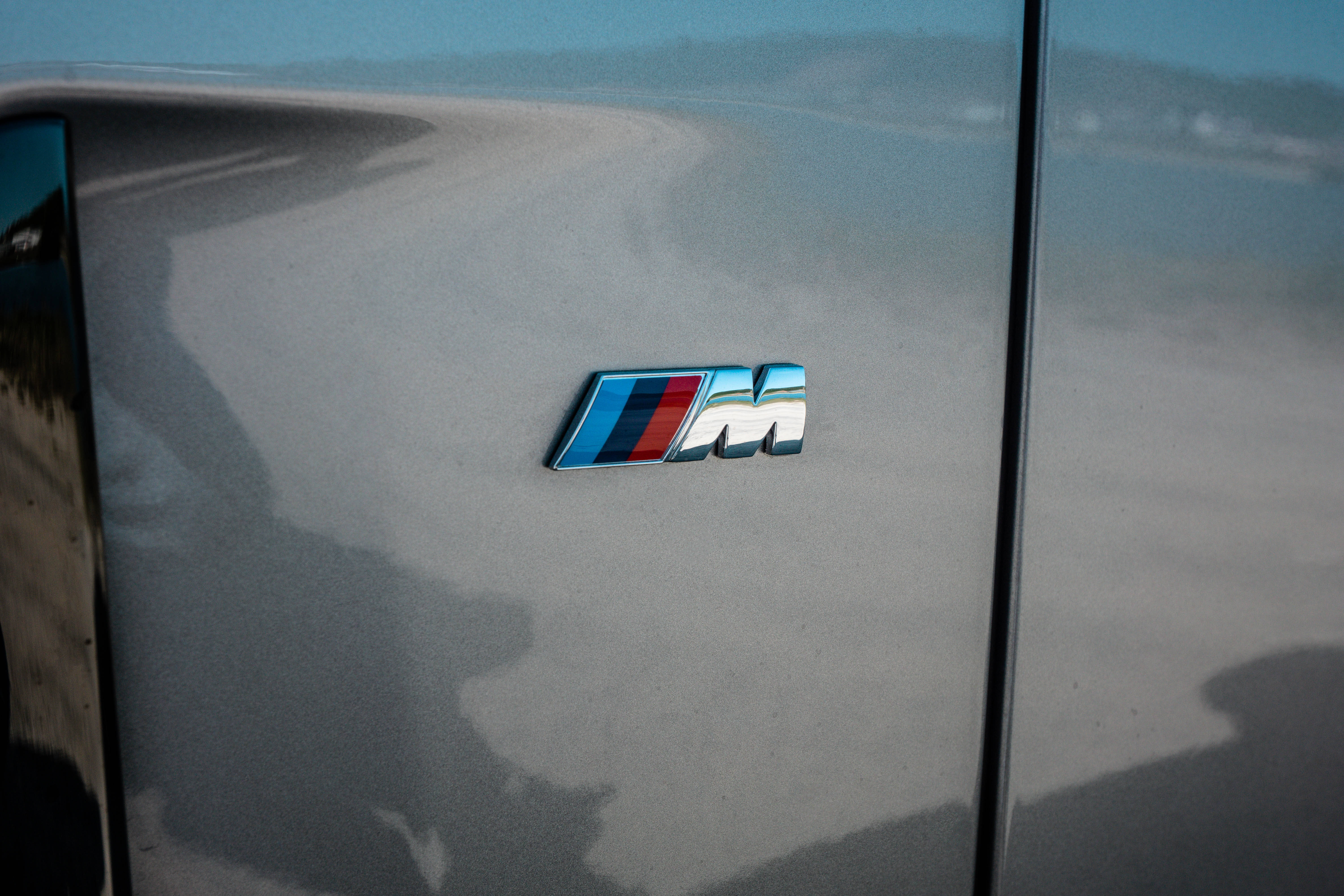 Download Close-up Bmw M3 Logo Emblem Wallpaper 