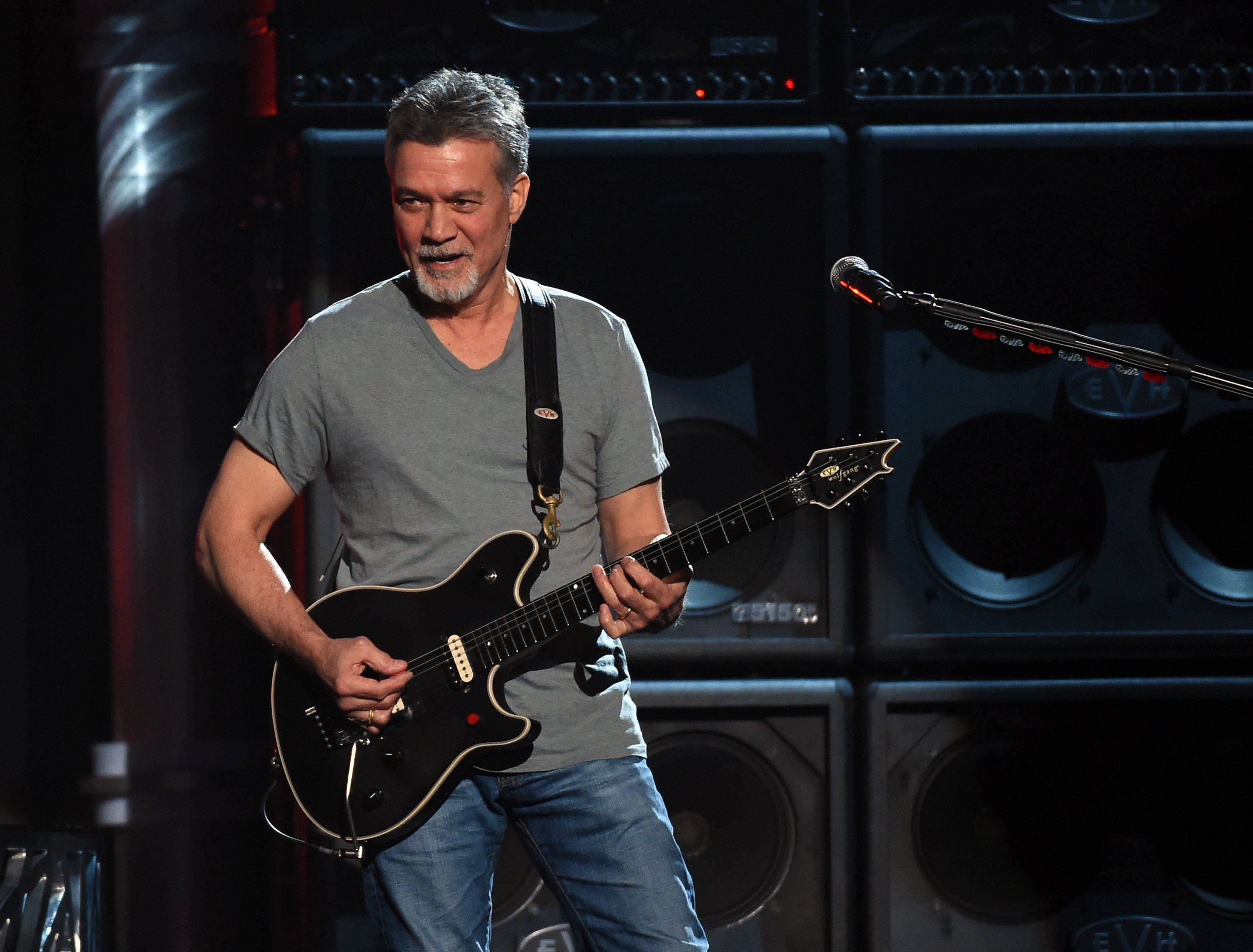 Download Eddie Van Halen With Black Guitar Wallpaper 
