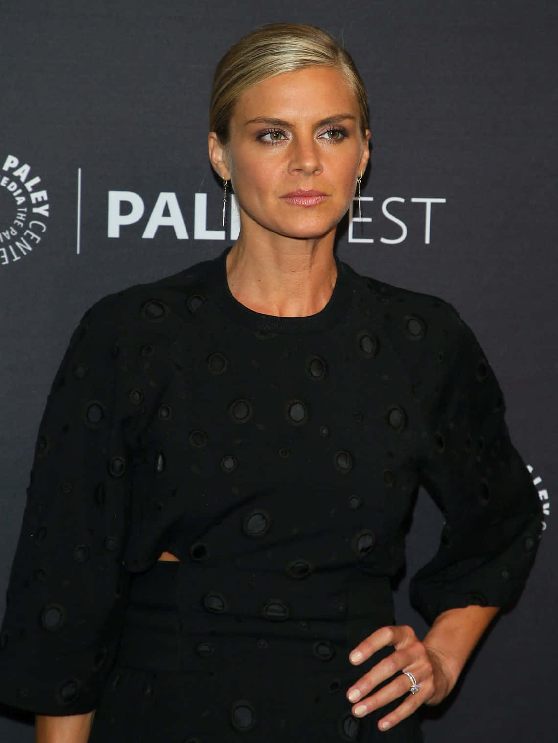 Download Eliza Coupe striking a pose in a beautiful setting Wallpaper