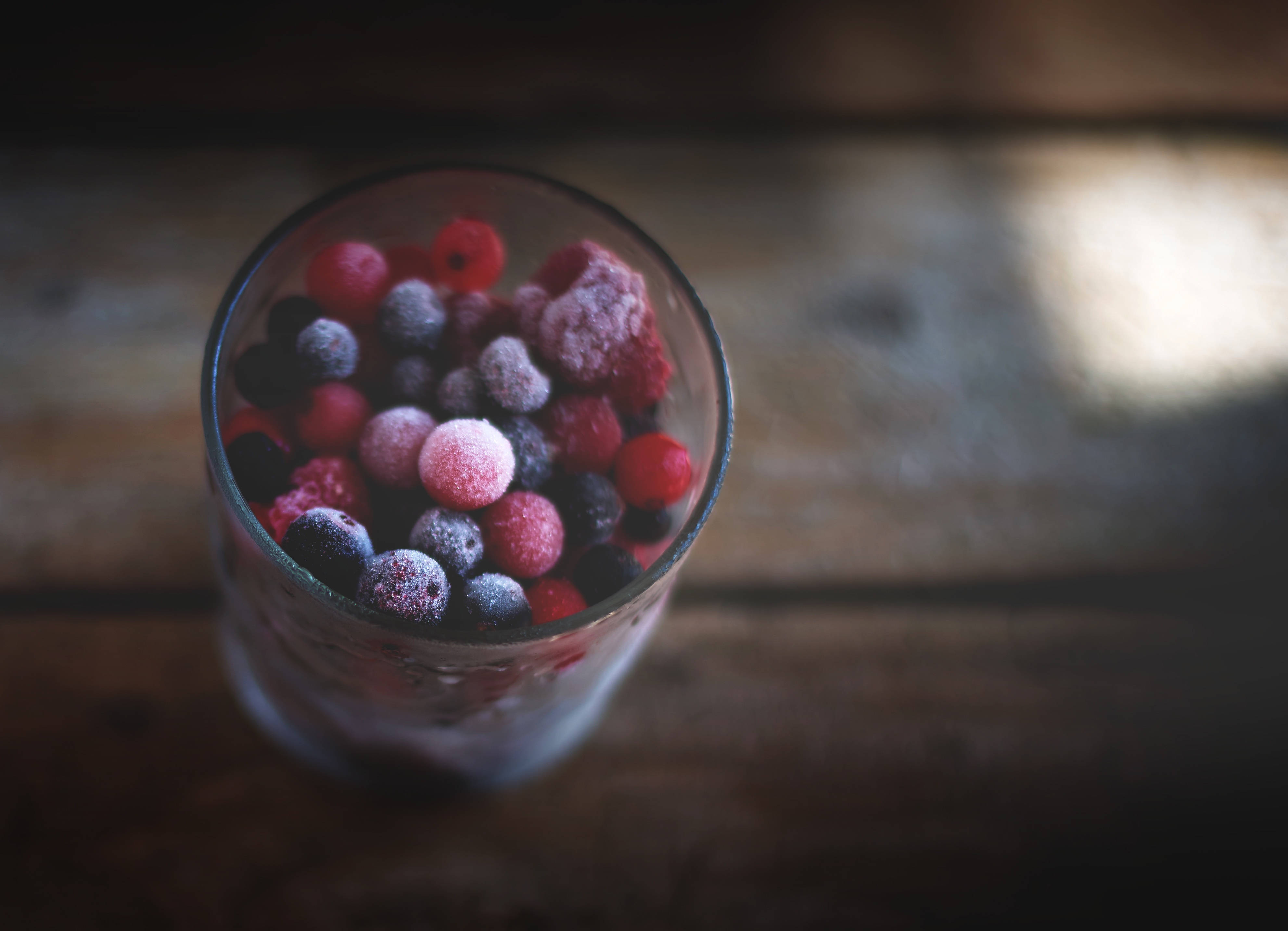 Frozen Berries In Cup Background