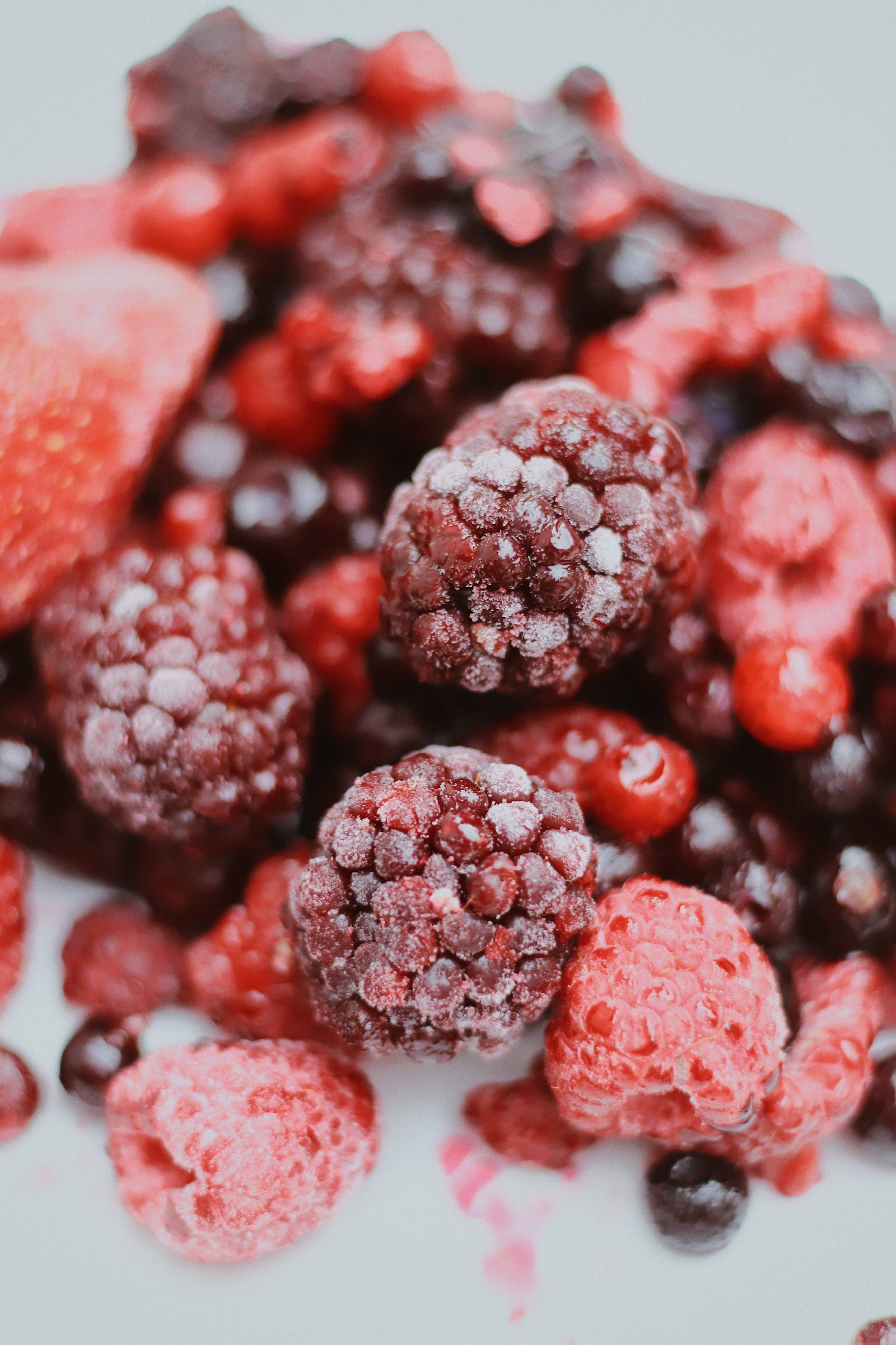 Frozen Berries On Yogurt Background