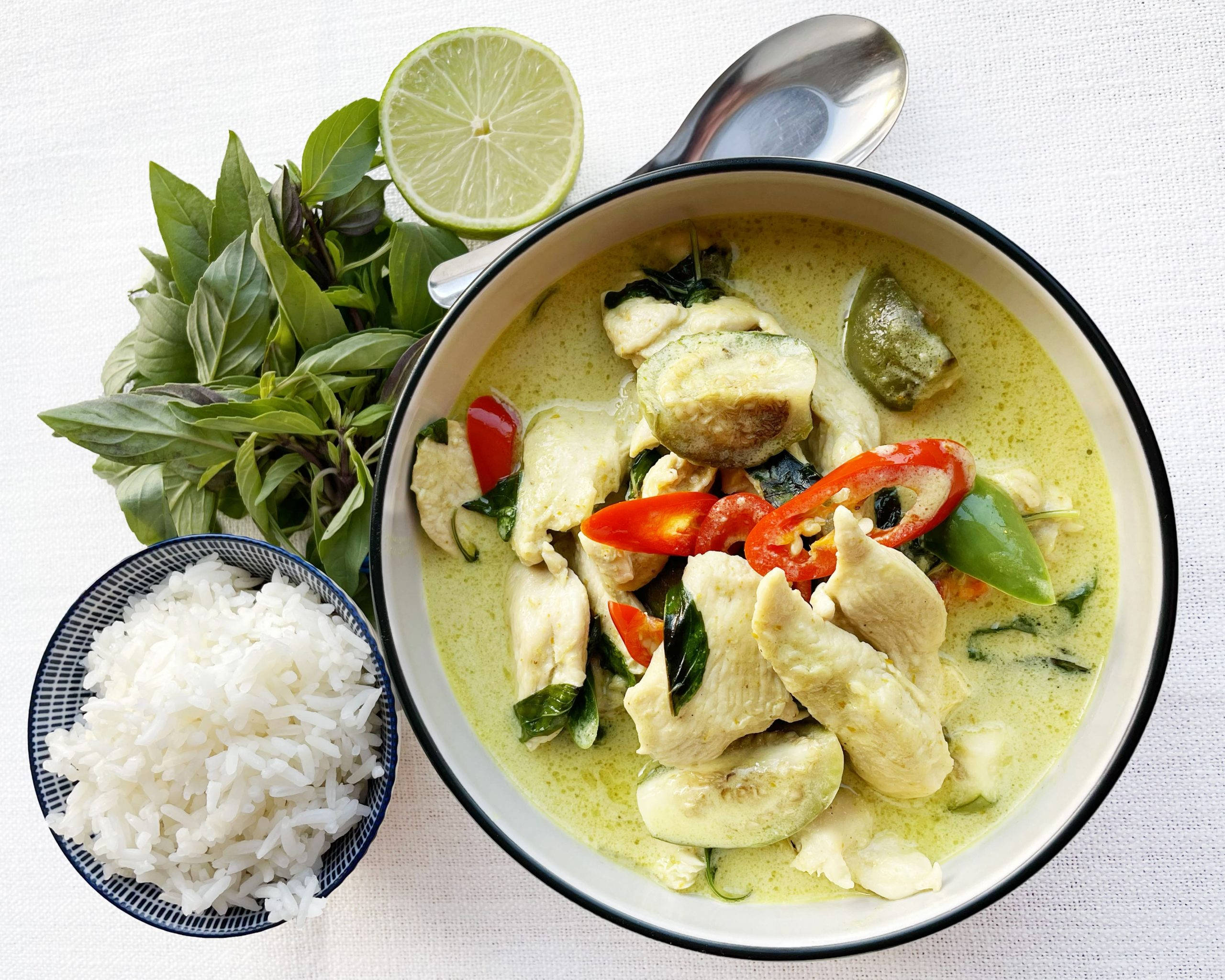 Download Green Thai Curry Chicken With Rice Wallpaper | Wallpapers.com