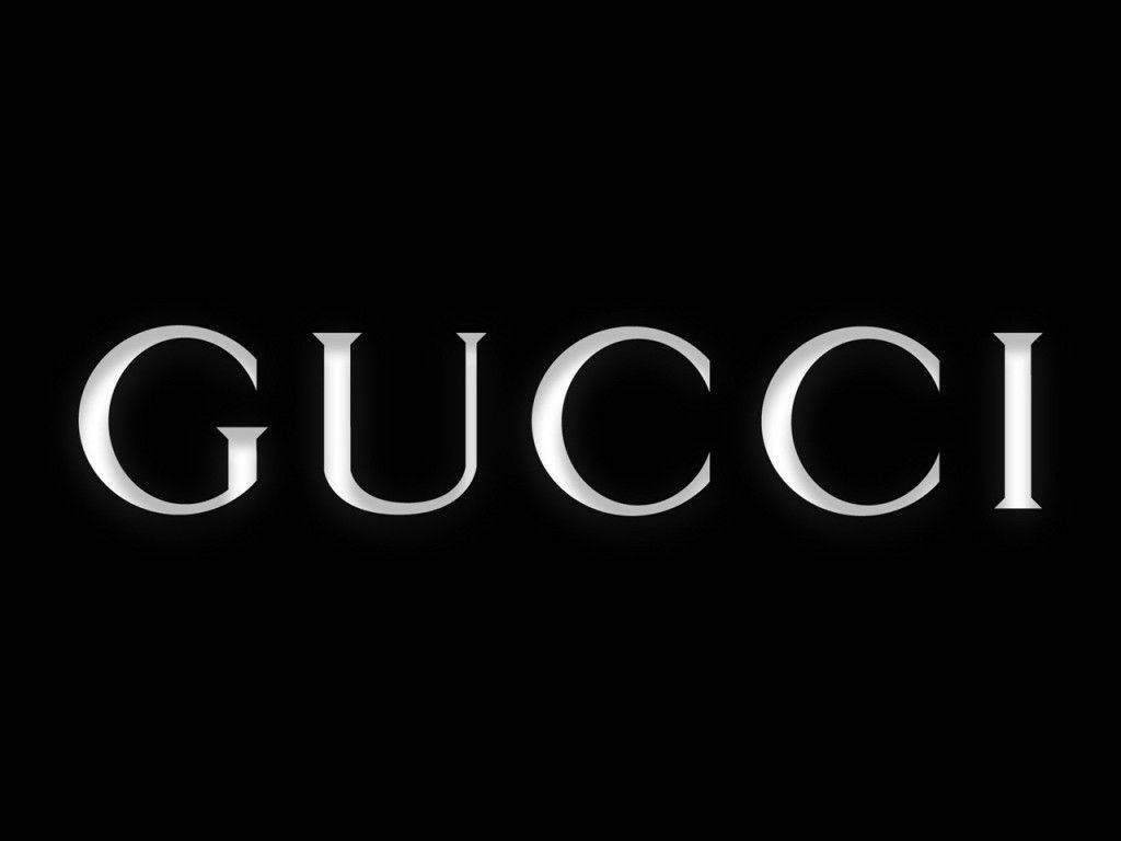 Gucci Logo On A Black Background Background