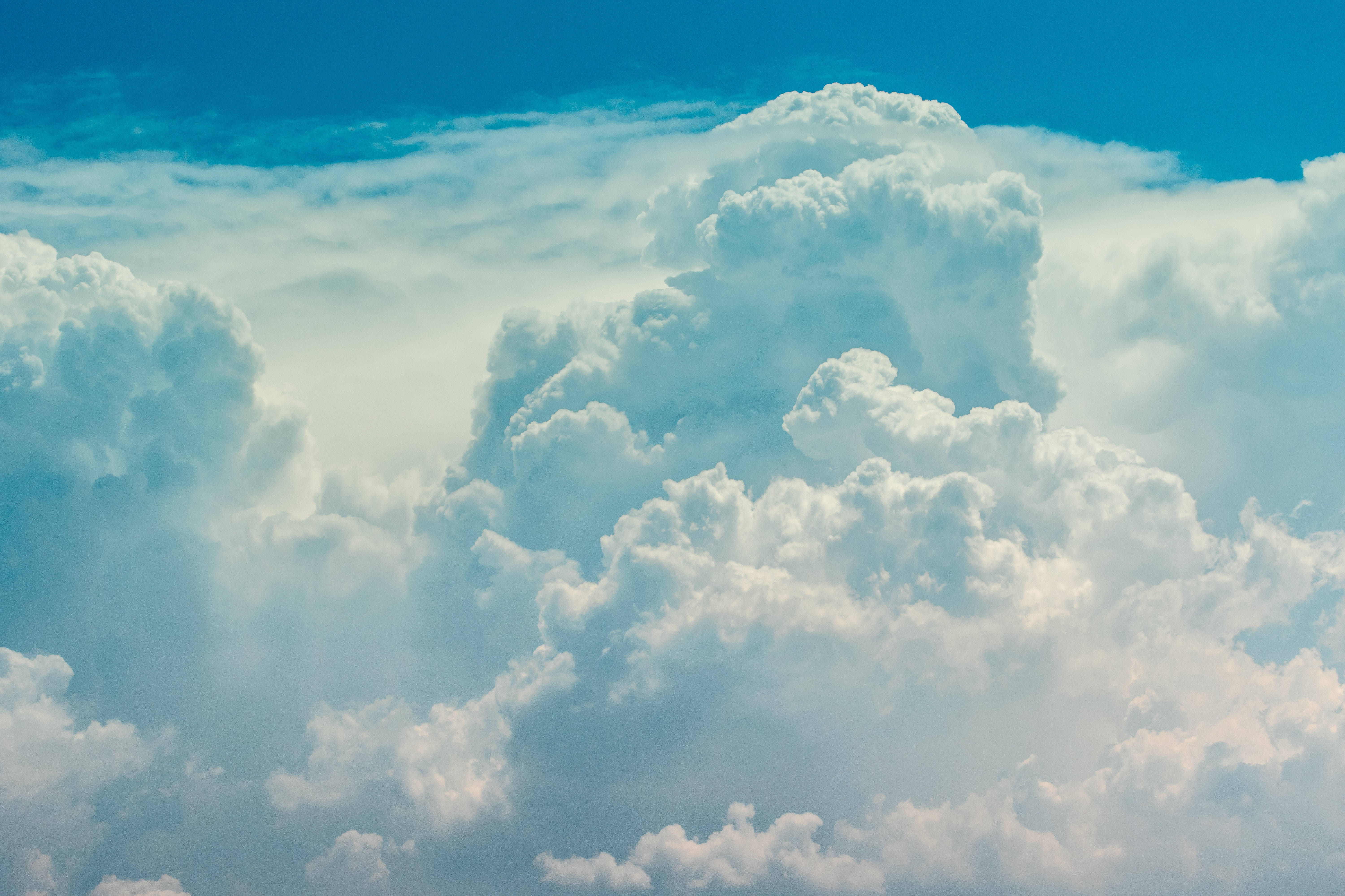 Heavenly White Fluffy Clouds Background