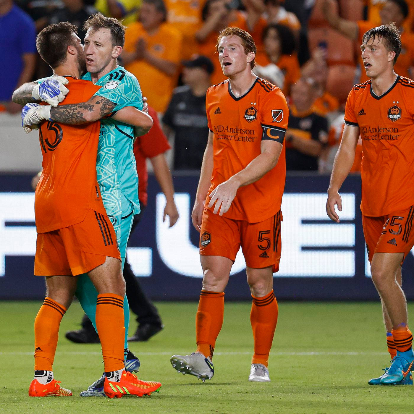 Download Houston Dynamo Players Hugging Wallpaper