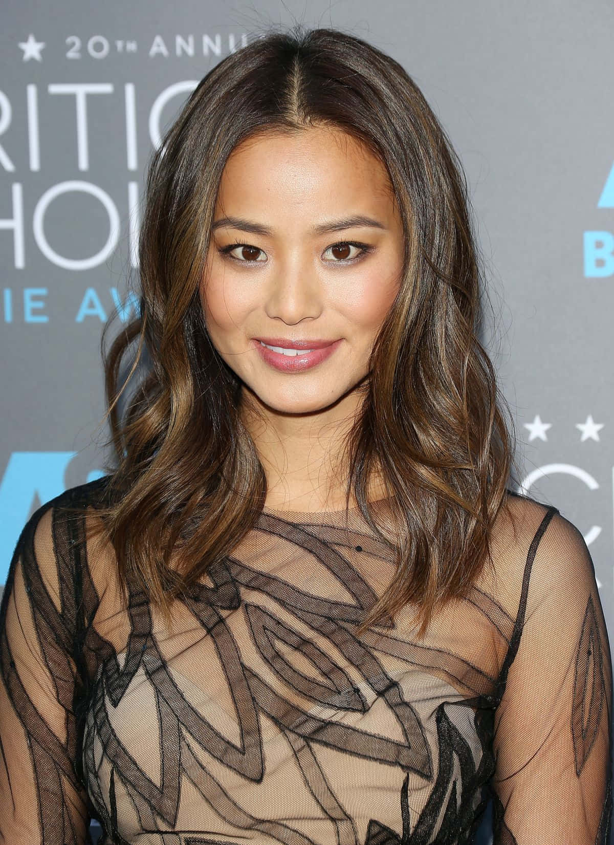 Download Jamie Chung striking a pose in a captivating outfit. Wallpaper ...