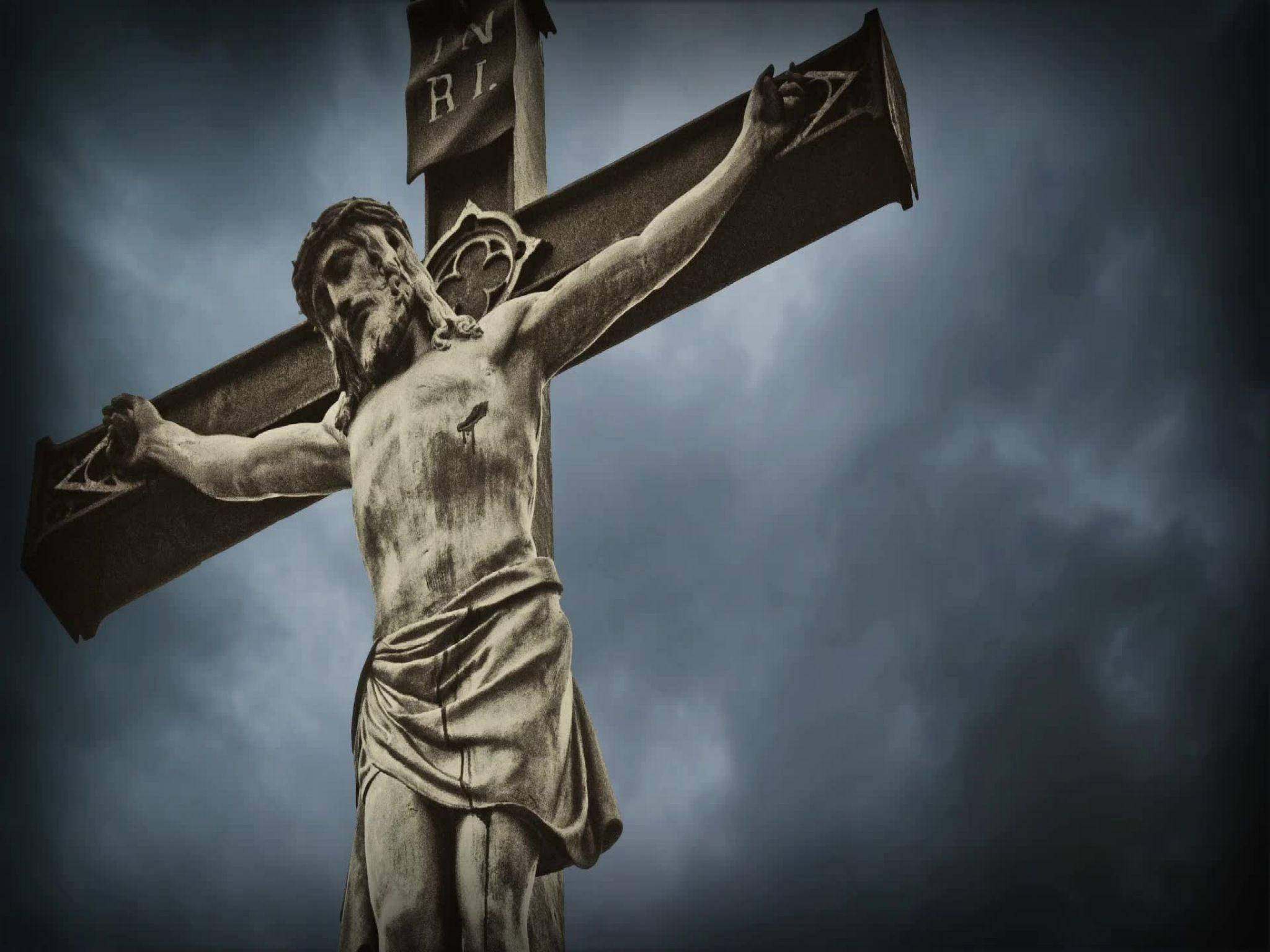 Download Jesus On Cross With Stormy Clouds Wallpaper | Wallpapers.com