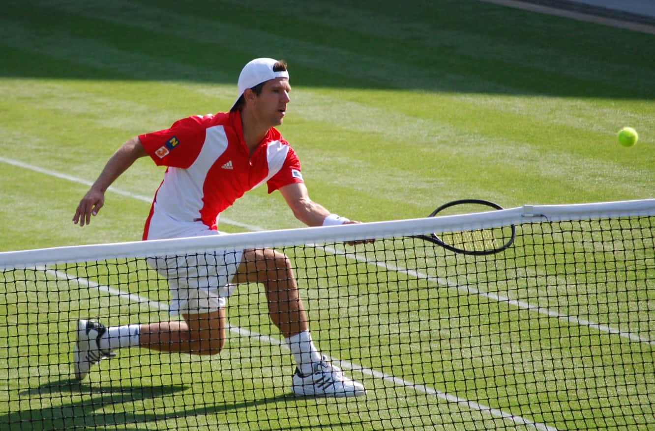 Download Jurgen Melzer In Red And White Tennis Attire Wallpaper 