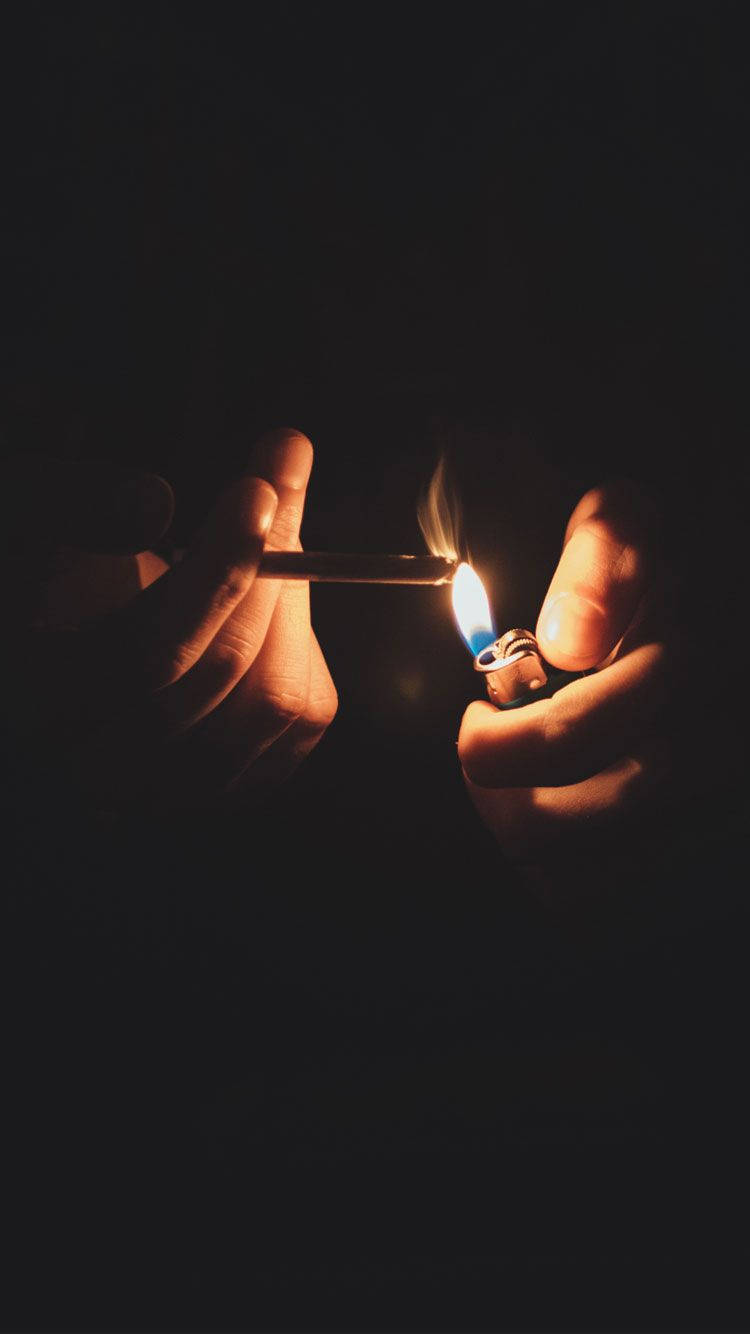 Lighting Cigarette In The Dark Iphone Background