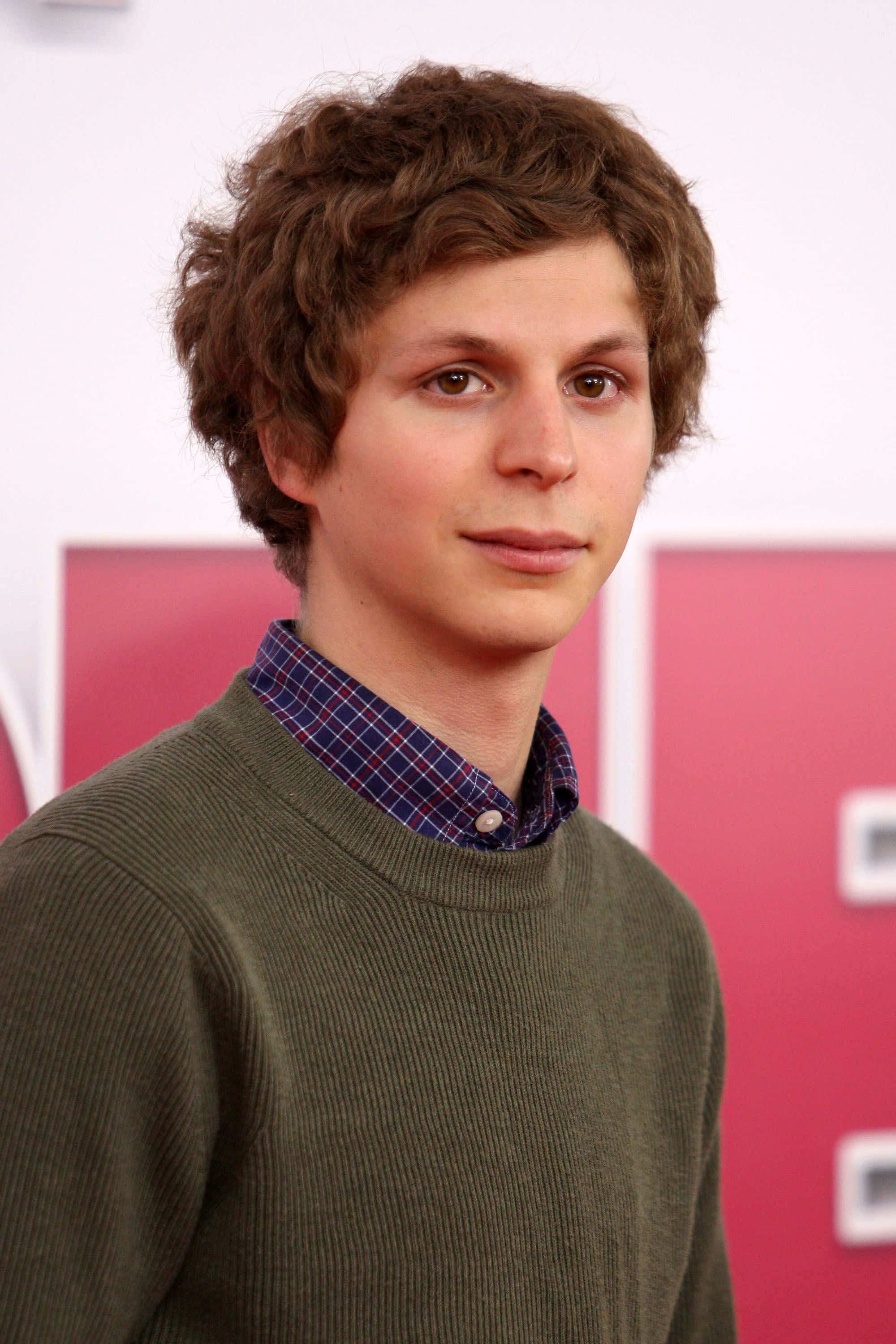 Download Award-winning actor Michael Cera posing for a professional