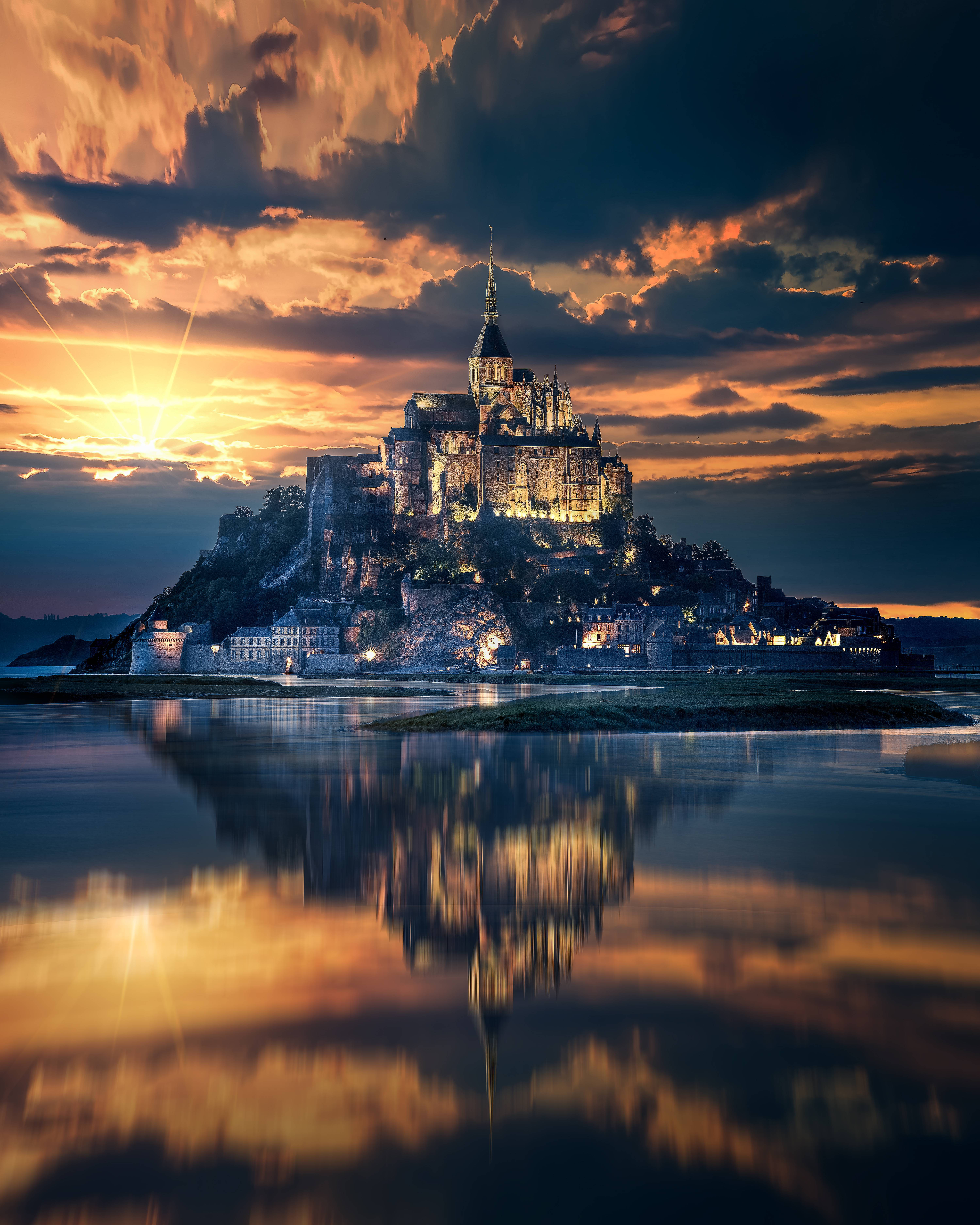 Mont Saint Michel At Sunset Background