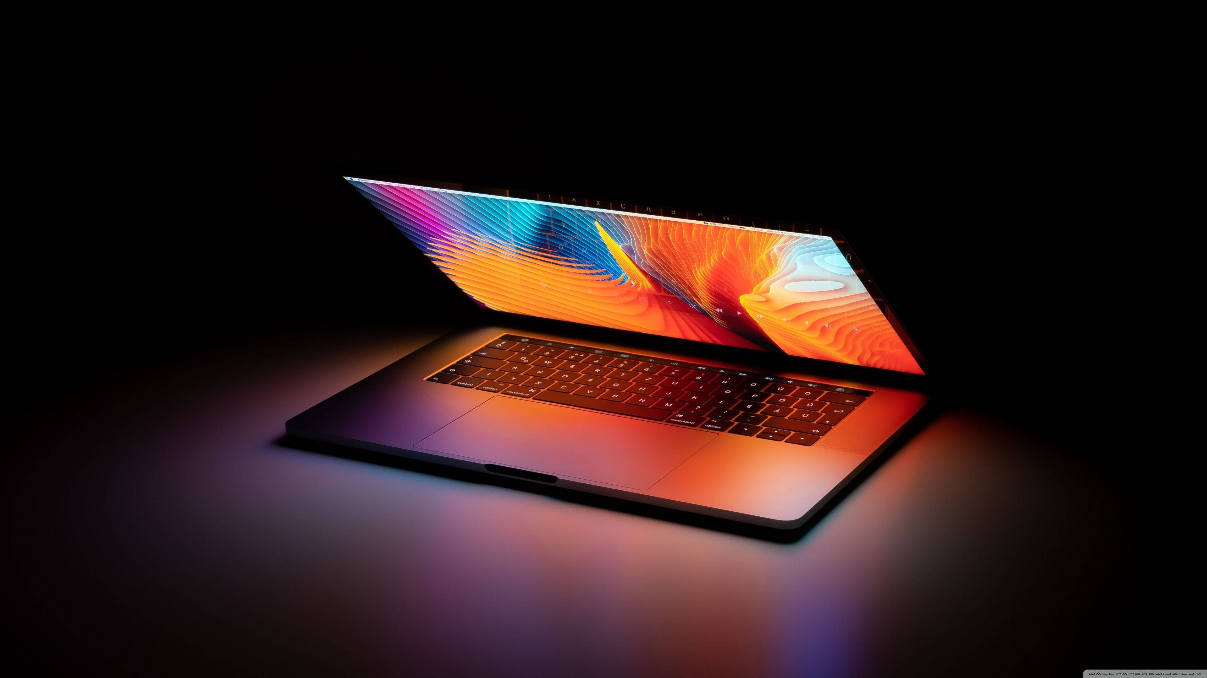 Open Laptop In Dark Background