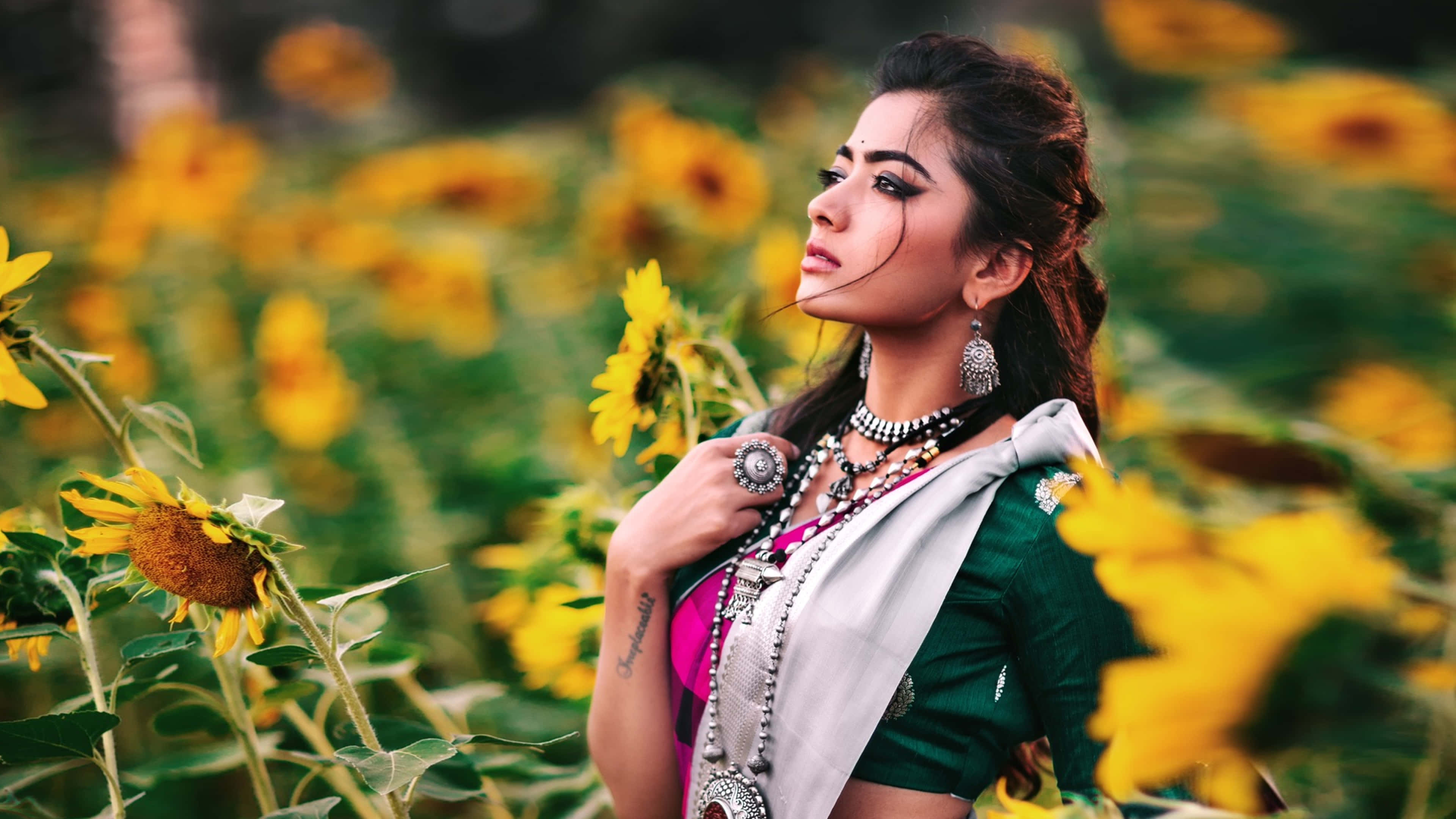 Download Rashmika Mandanna Hd 4k Sunflower Field Wallpaper | Wallpapers.com