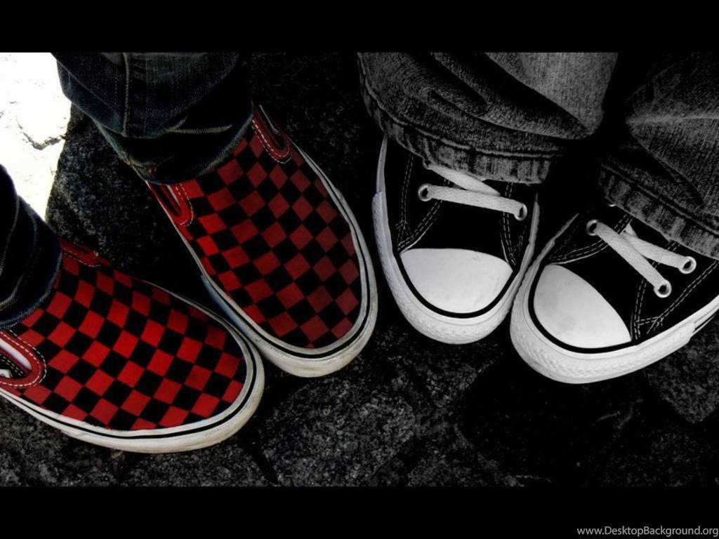 Red And Black Vans On Feet Background