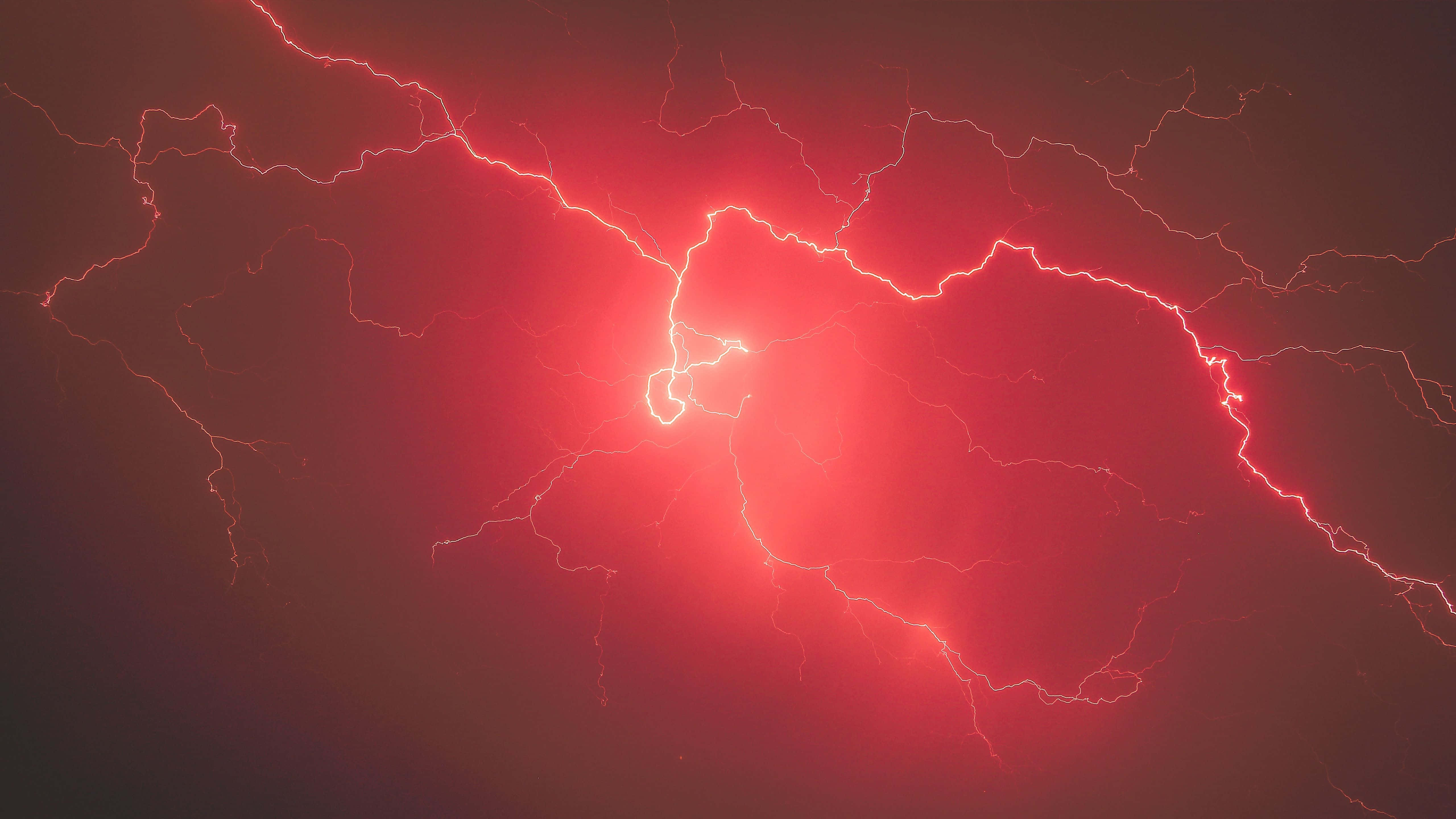 Download Striking And Powerful Red Lightning | Wallpapers.com