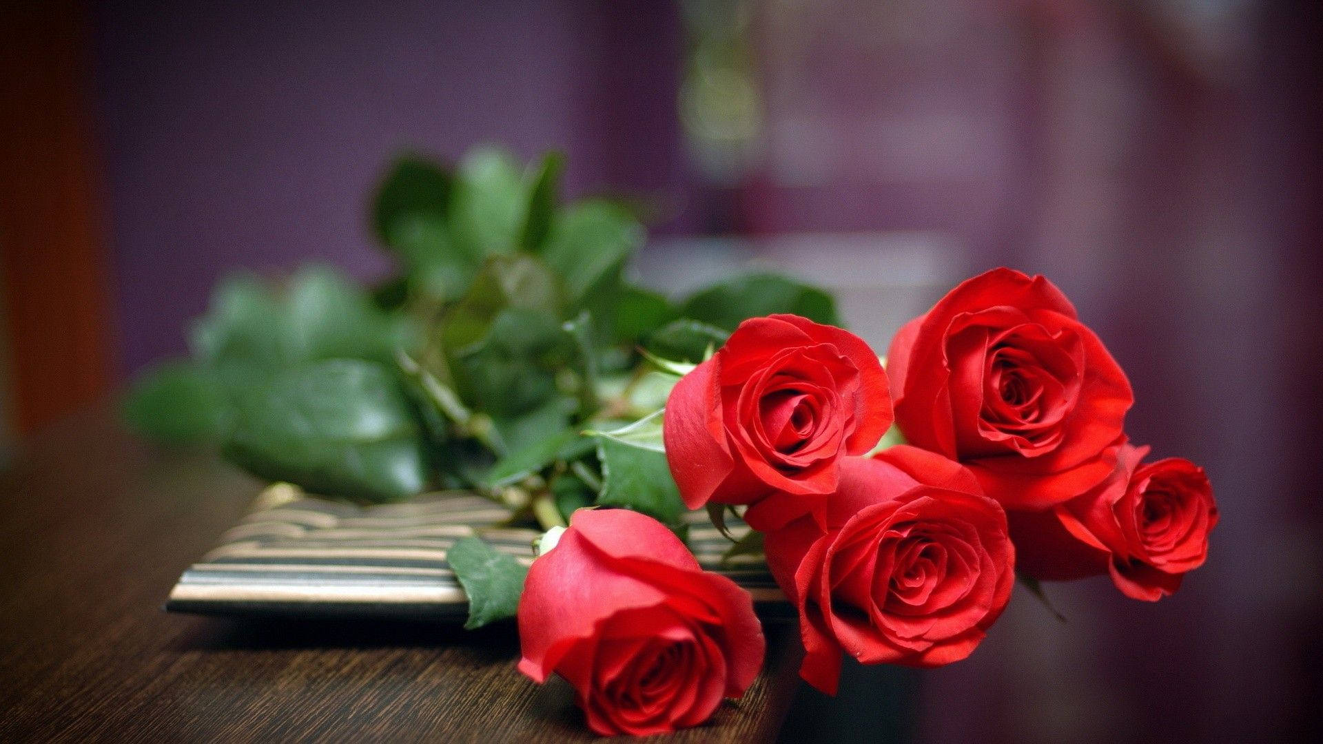 Red Roses On A Table Background