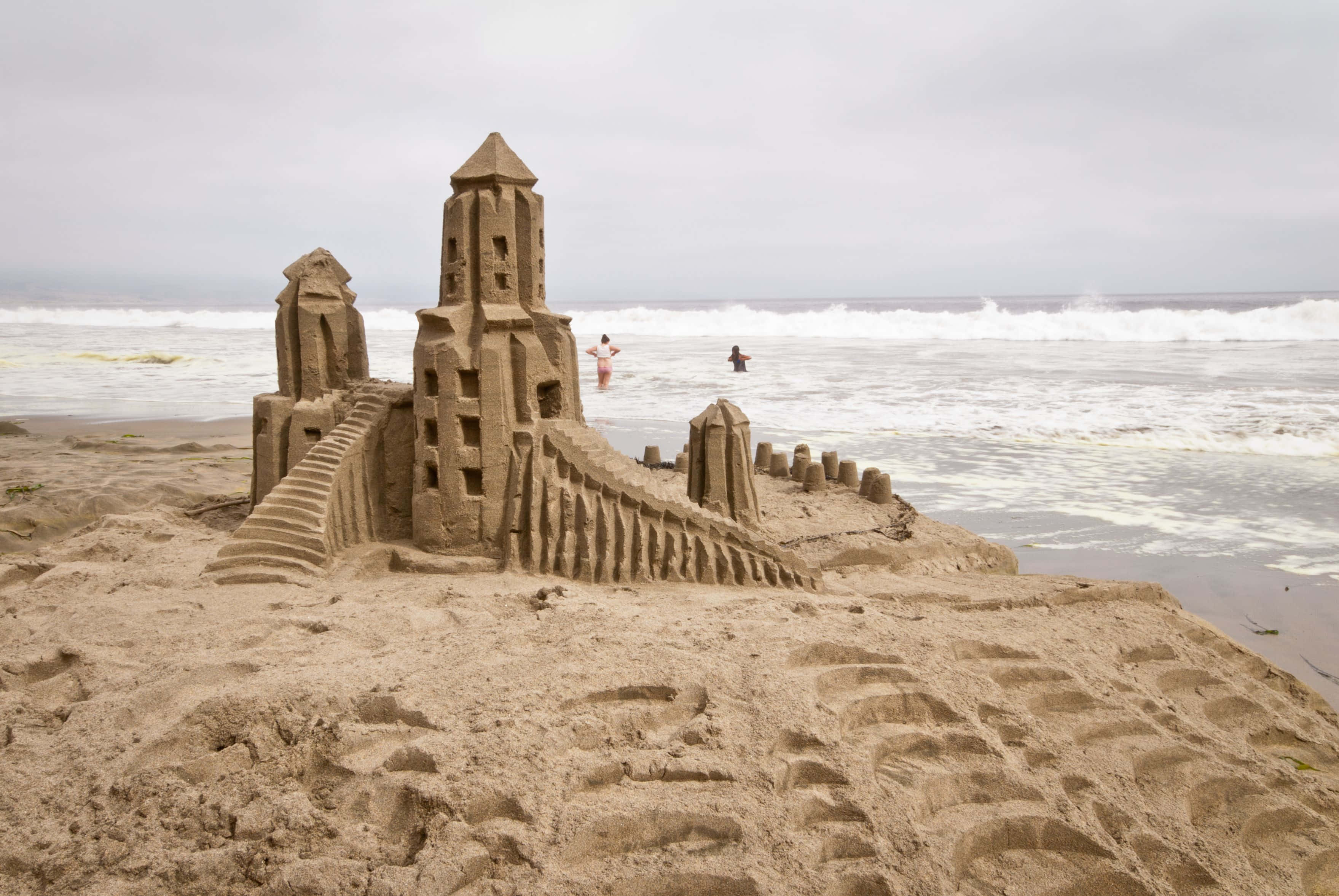 Download Amazing Sandcastle Masterpiece On A Sunny Beach Wallpaper