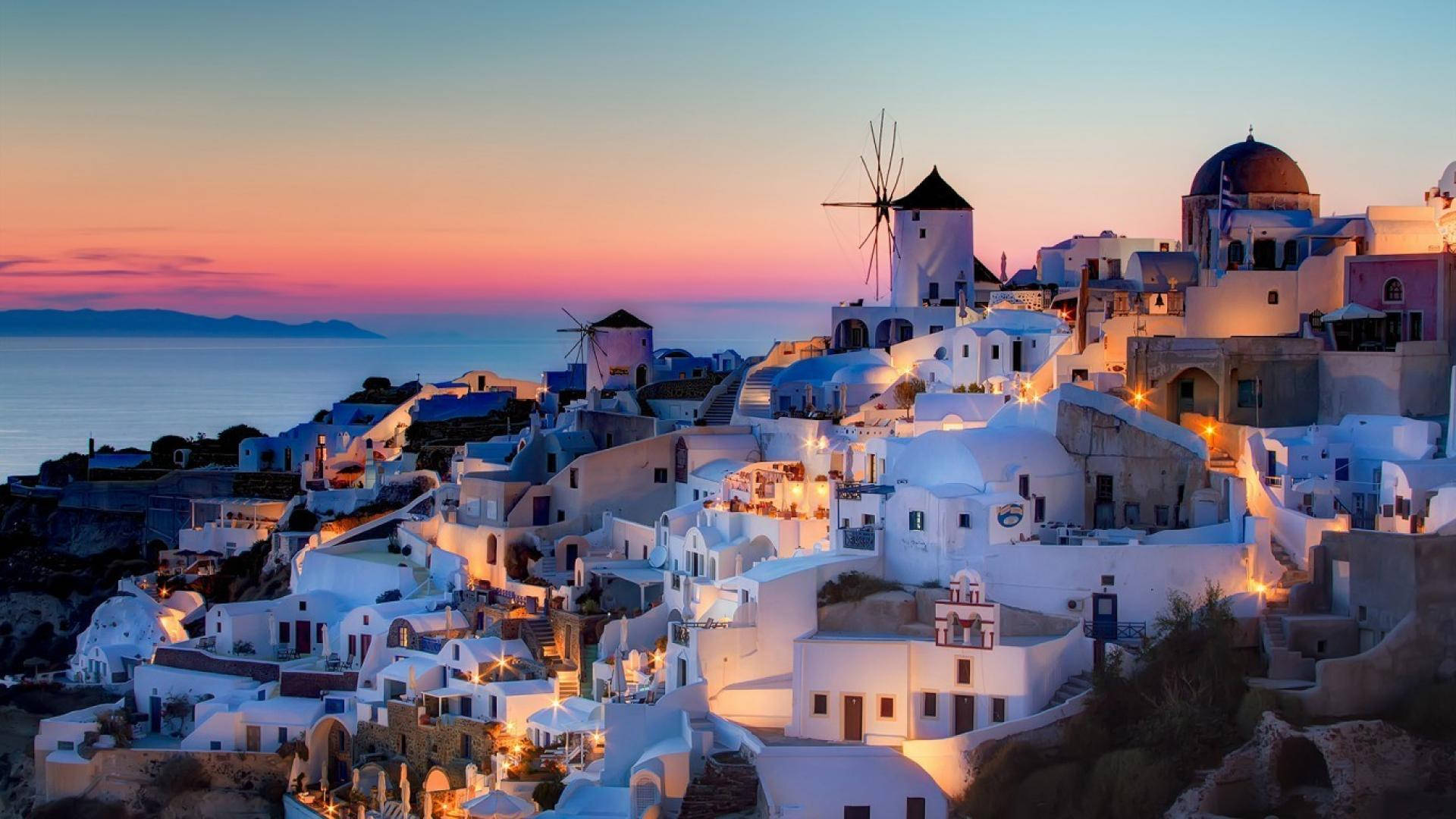 Santorini Houses In Greece Sunset Background