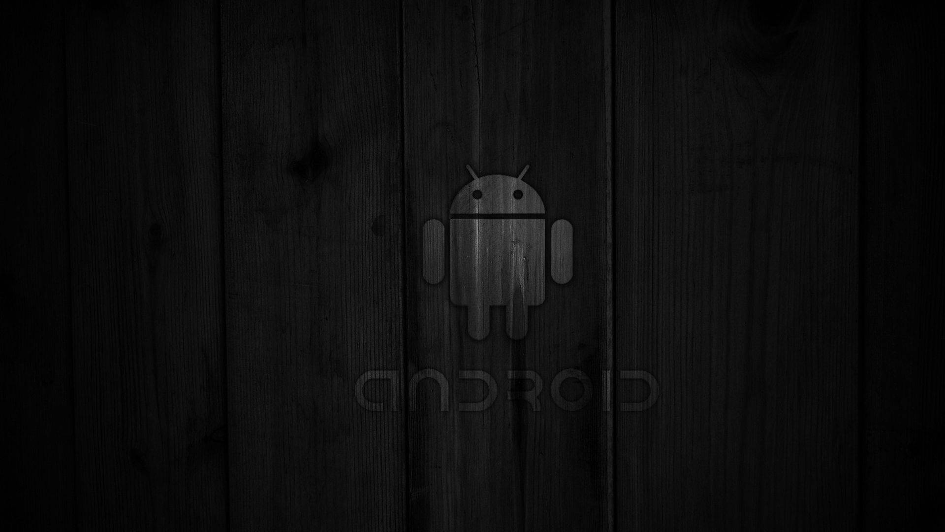 Downloaden Schwarzes Android-logo Aus Holz | Wallpapers.com