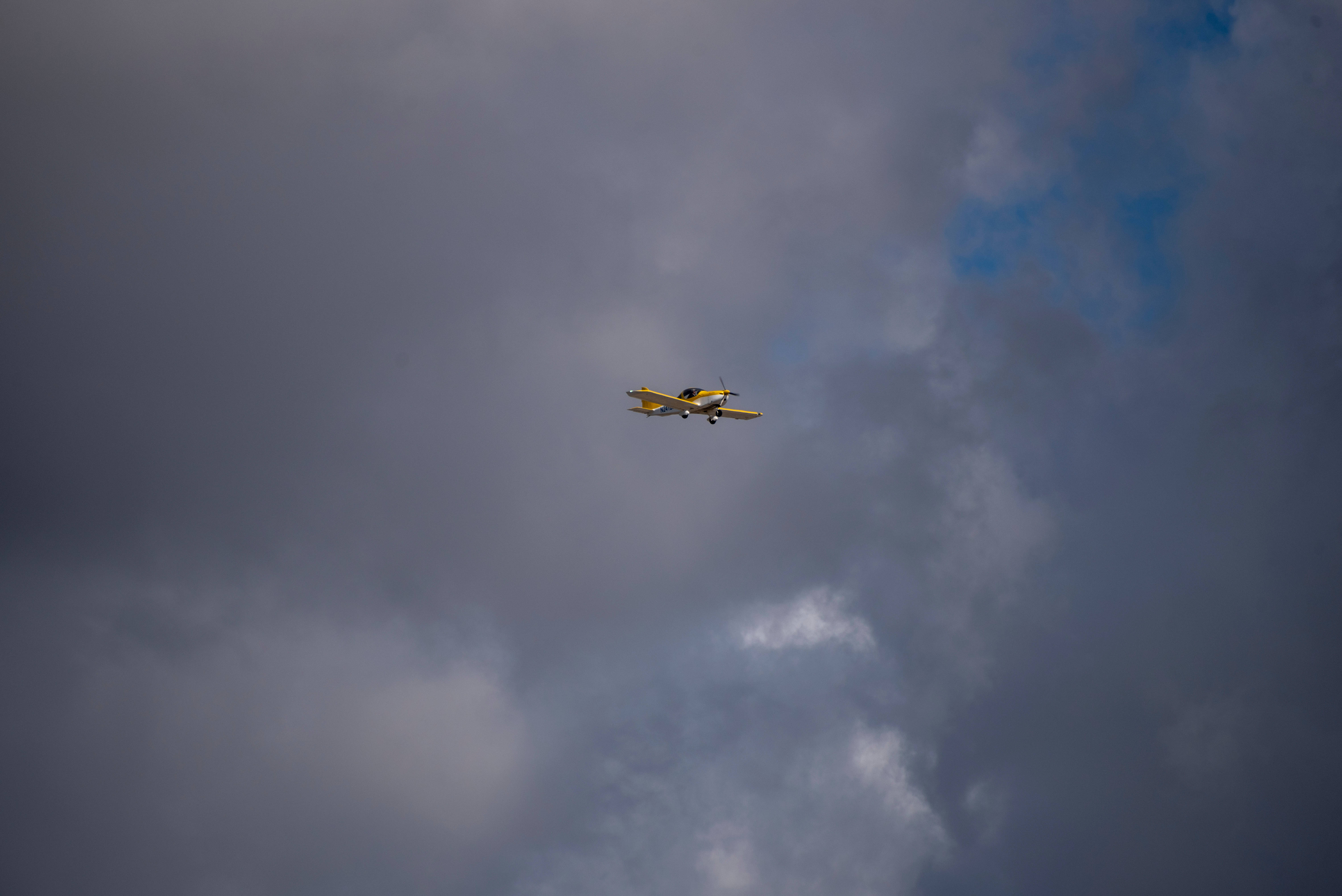 Download Small Yellow Plane In Sky Wallpaper 