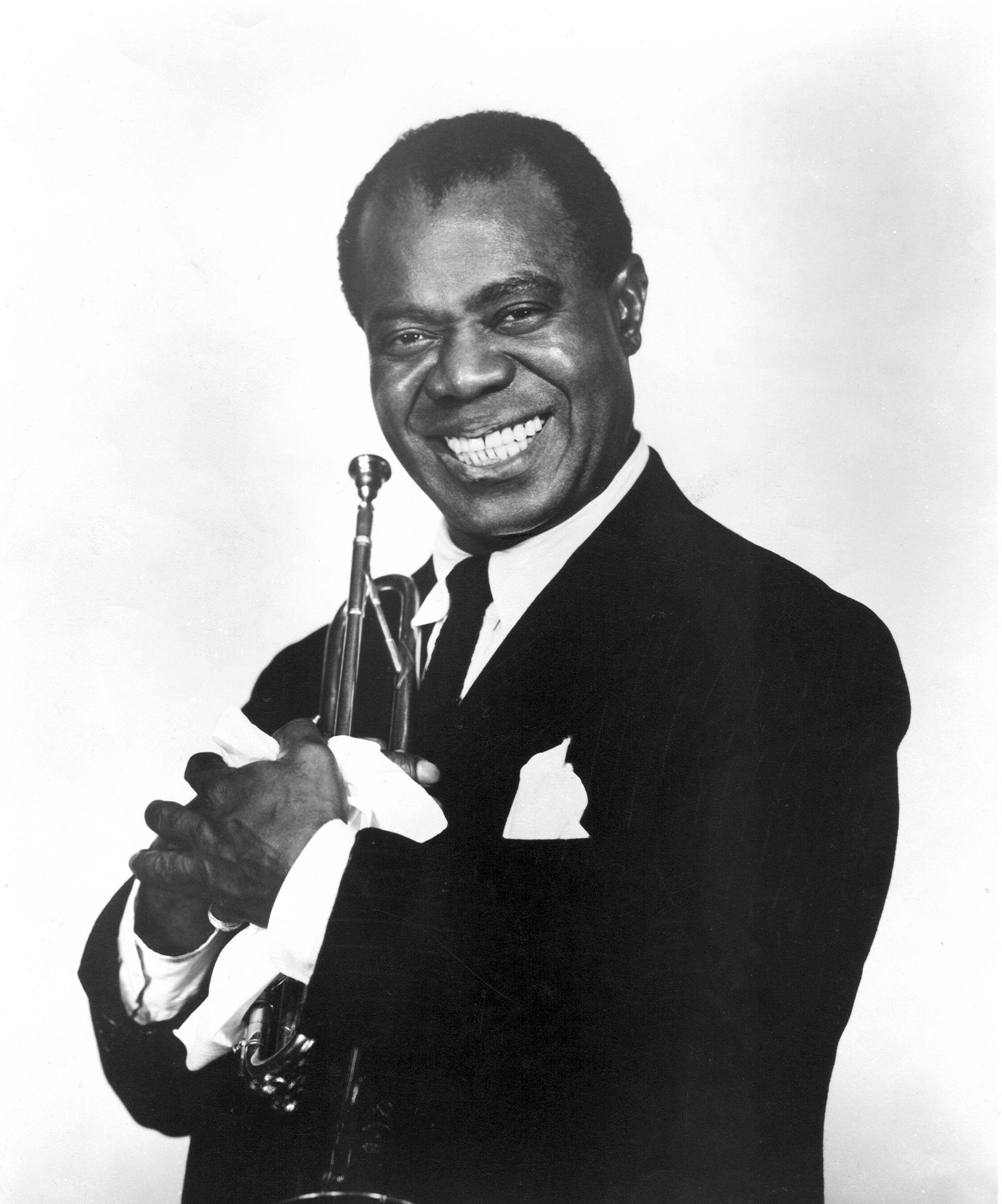 Download Smiling Louis Armstrong Black And White Wallpaper | Wallpapers.com