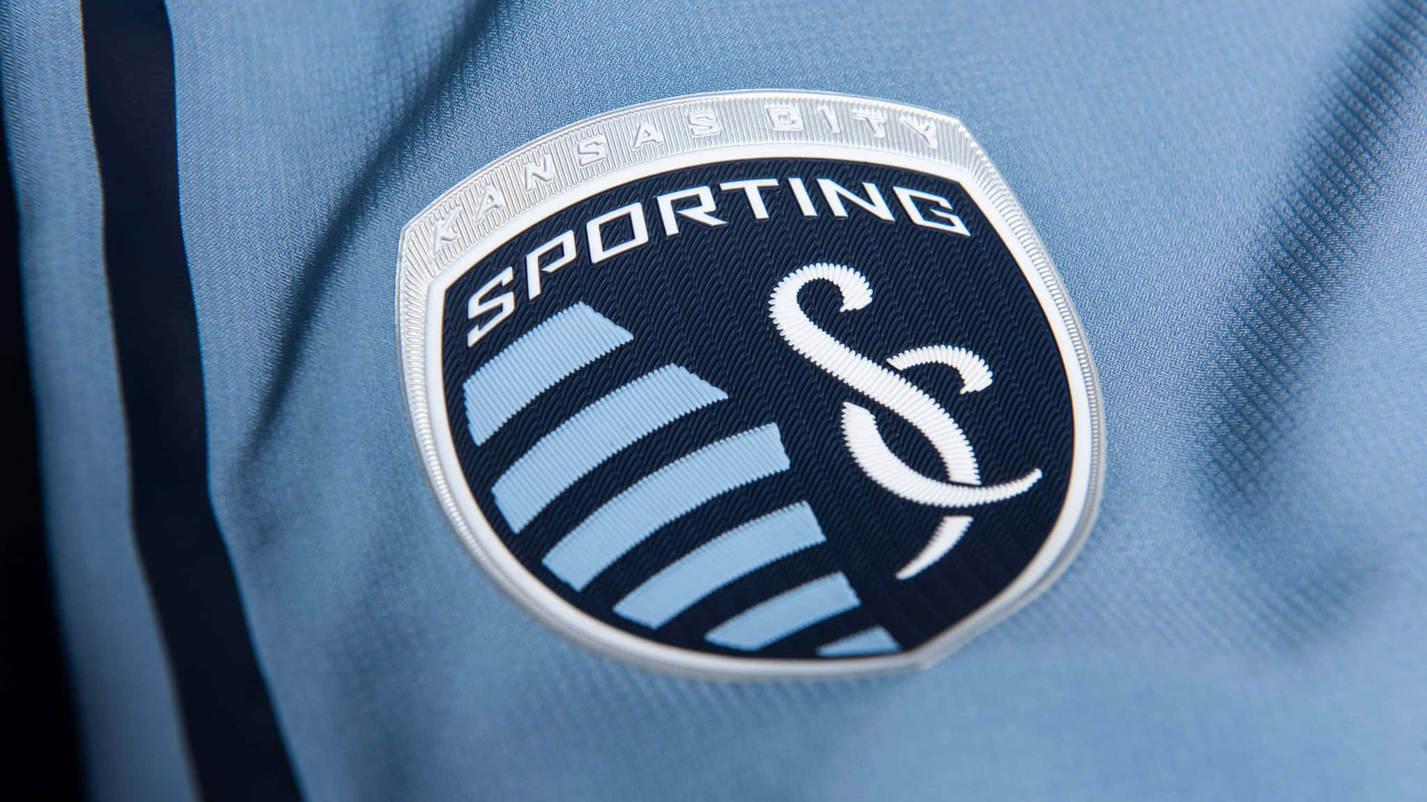Download Sporting Kansas City Logo On Jersey Wallpaper