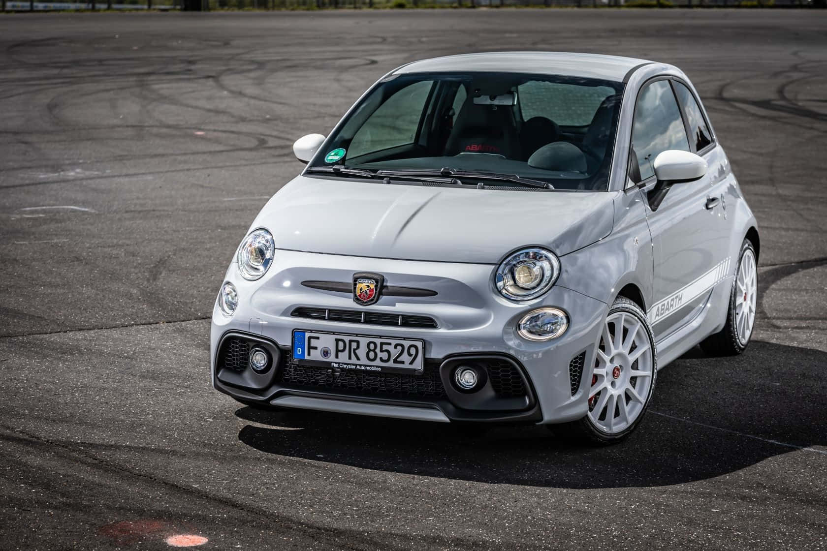 Download The Vibrant And Powerful Abarth 595 In Action Wallpaper ...