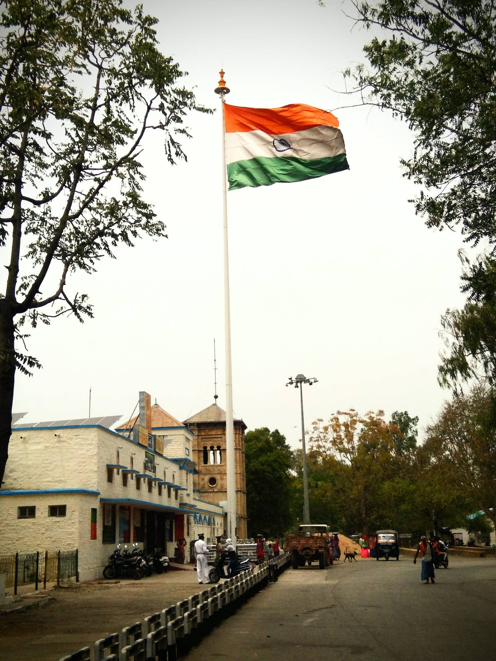 Download Tiranga Indian Flag Pole Beside Building Wallpaper 