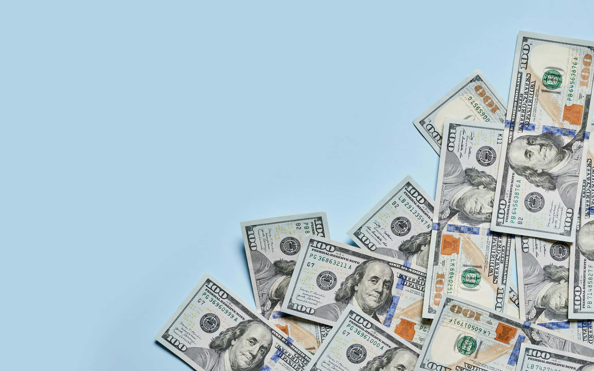 100 Dollar Bill Notes In Baby Blue Backdrop Wallpaper