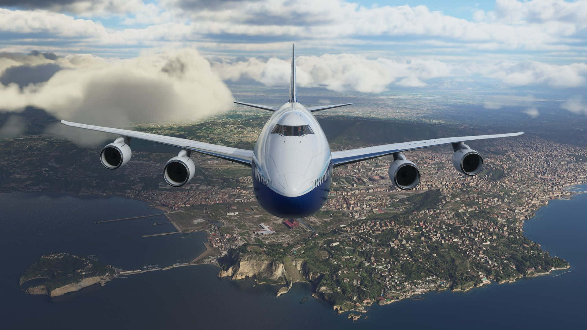 A Large Airplane Flying Over A City And Ocean