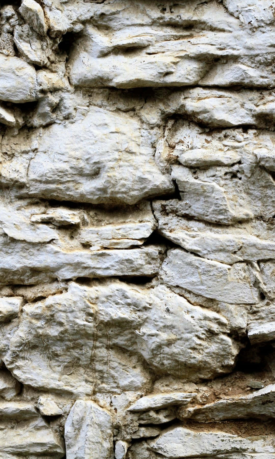 A Close Up Of A Stone Wall Wallpaper