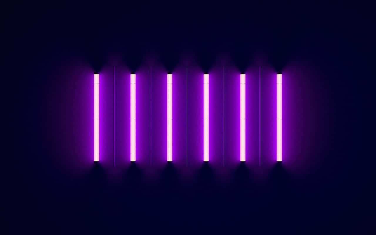 A Purple Light Is Shown On A Dark Background Wallpaper