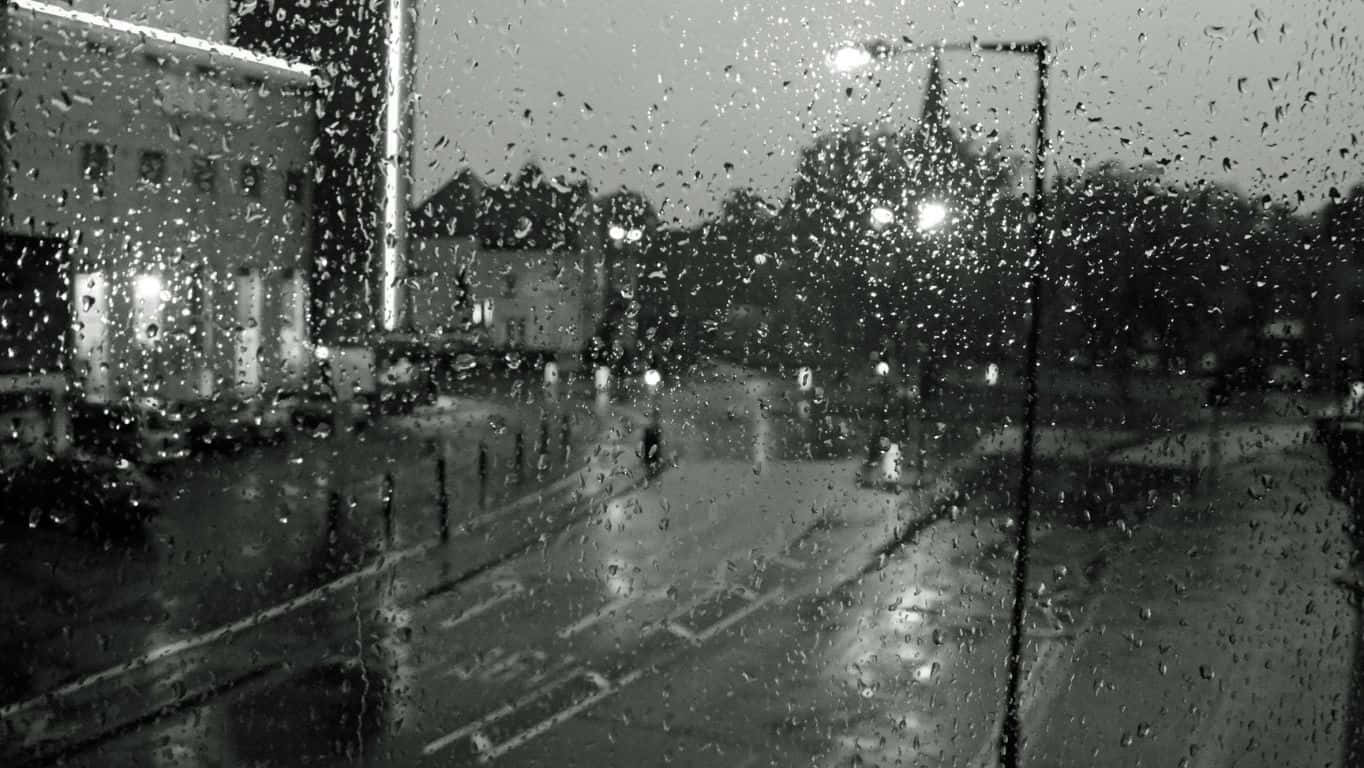 A Black And White Photo Of A Rainy Street Wallpaper