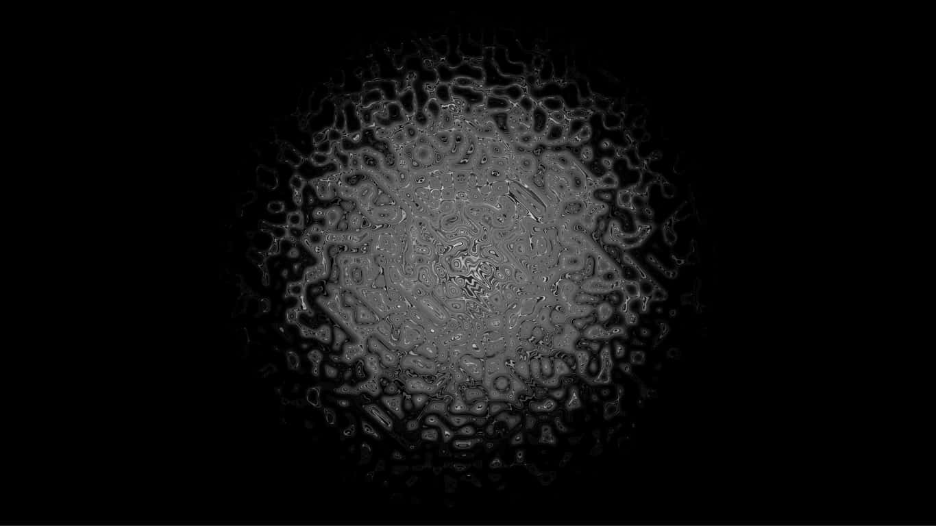 a black background with a circular pattern