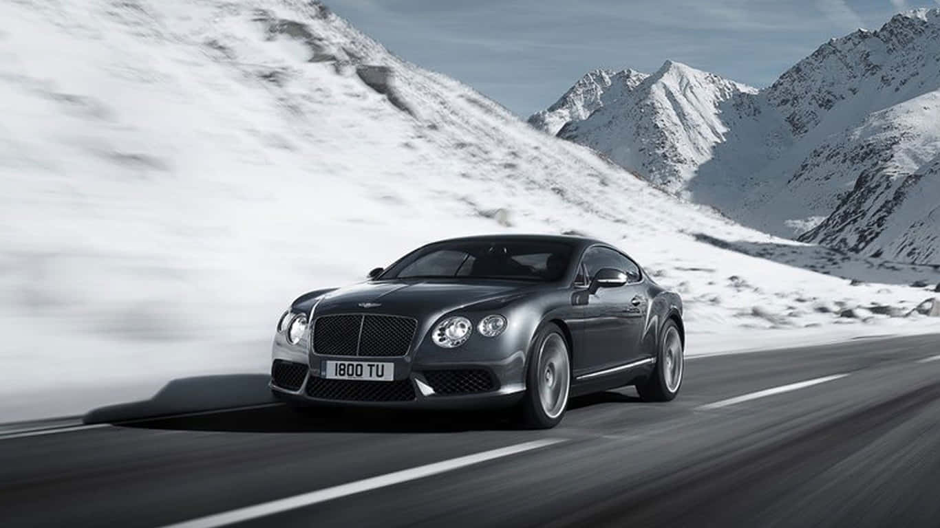 1366x768 Bentley Background 2017 Bentley Continental Gt Speed Snowy Mountains