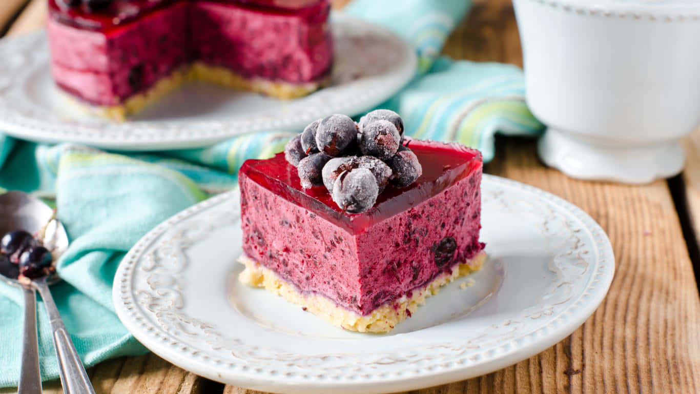 A Plate Of Cake With Berries On It