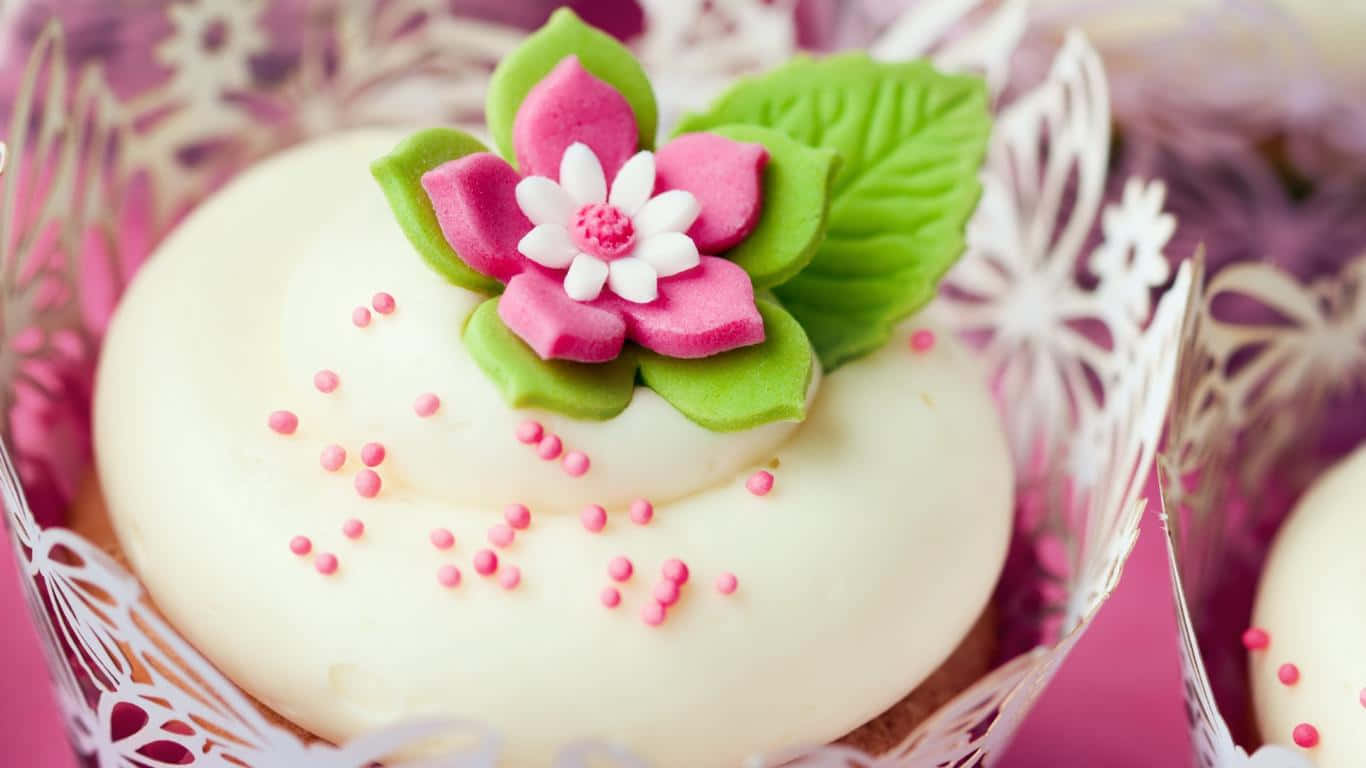 Cupcakes With Pink Flowers And White Frosting