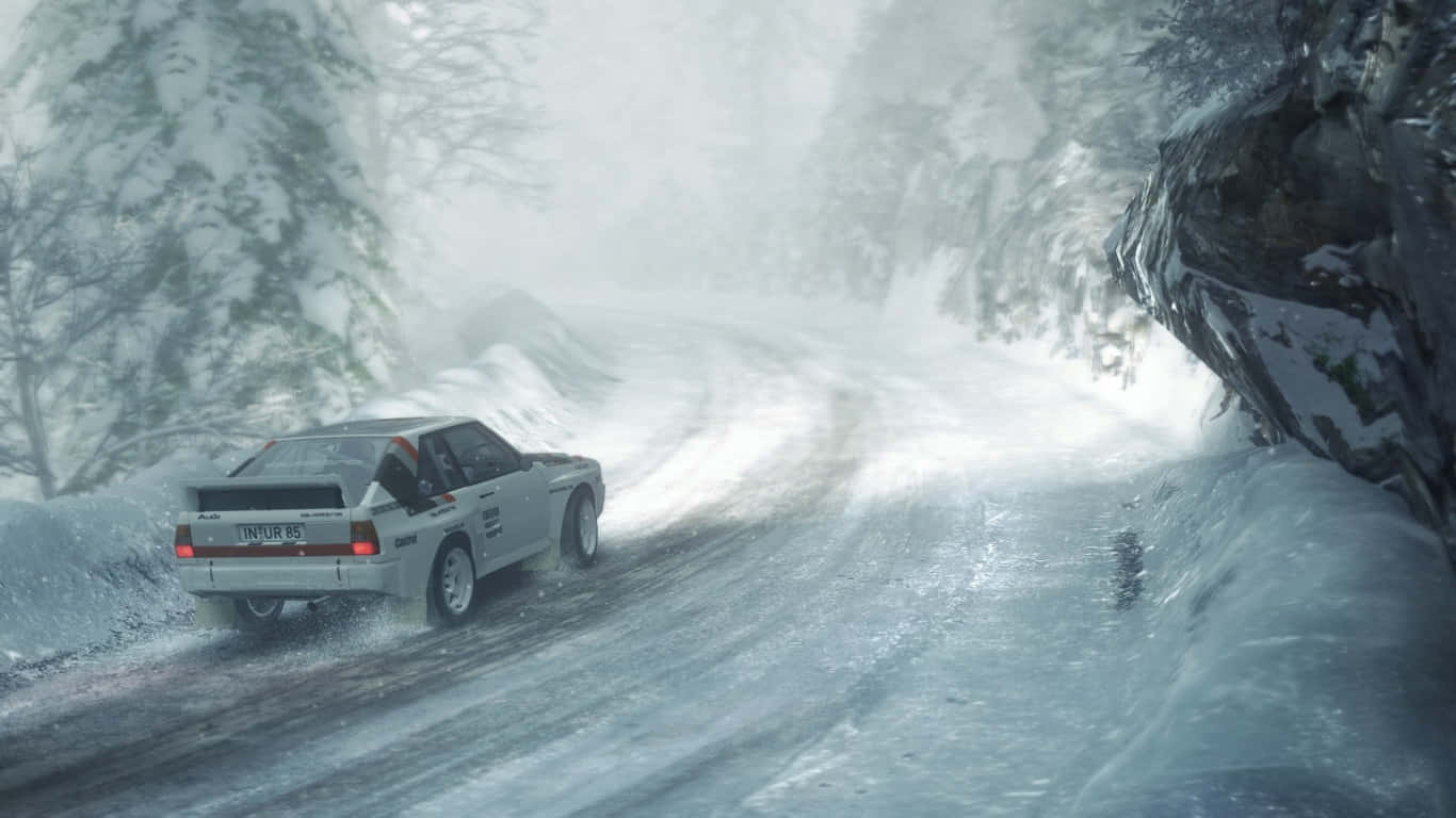 A White Car Driving Down A Snowy Road