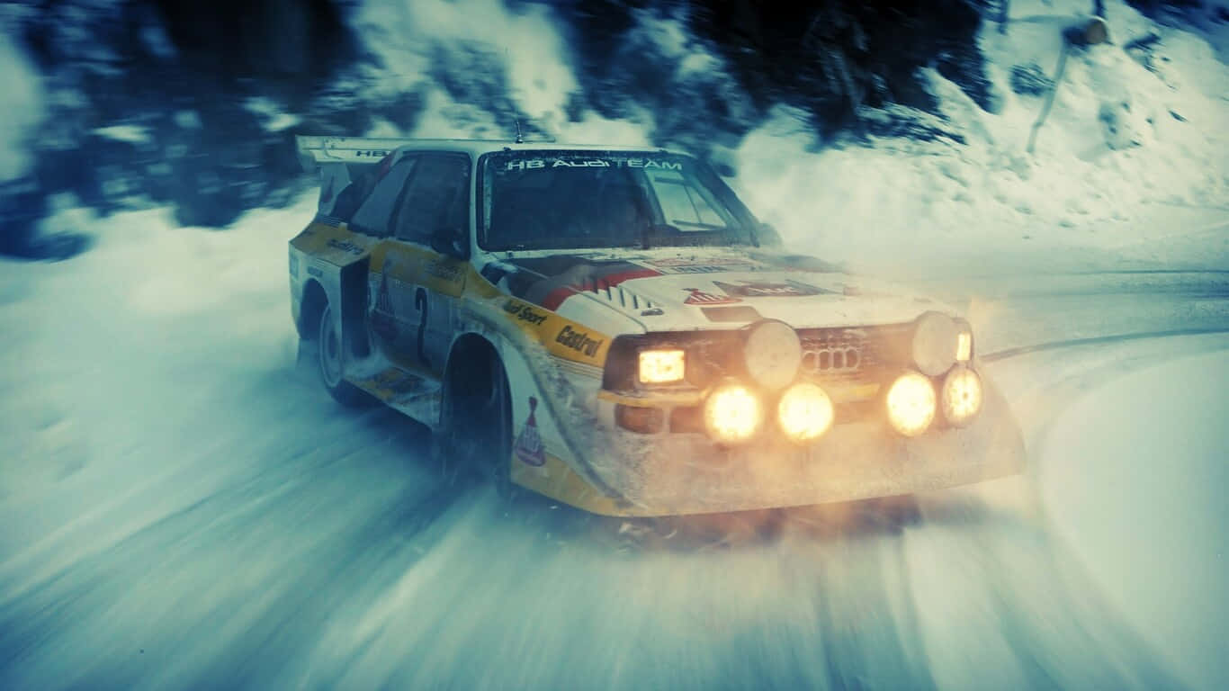 A Rally Car Driving Down A Snowy Road