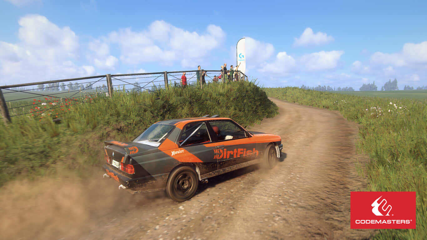 A Rally Car Driving Down A Dirt Road