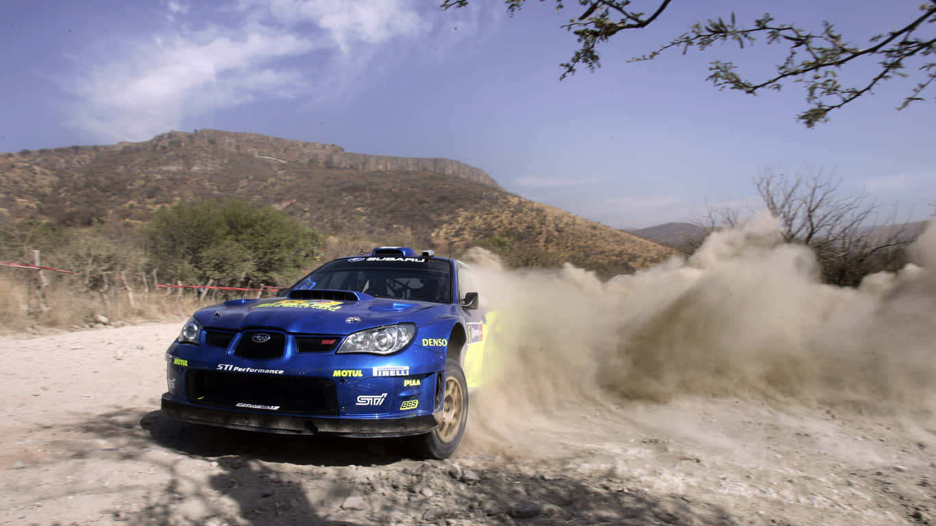 A Blue And Yellow Rally Car Driving Through Dirt