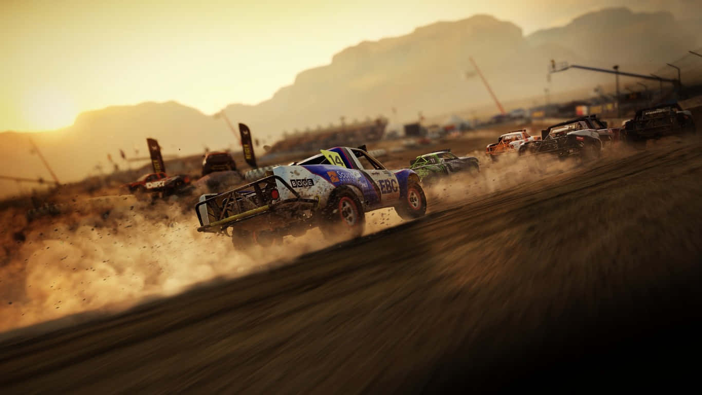 A Dirt Track With Several Cars Driving On It