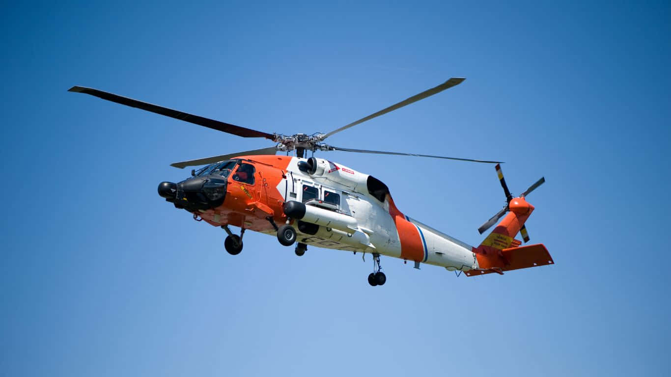 Unhelicóptero De La Guardia Costera Volando En El Cielo
